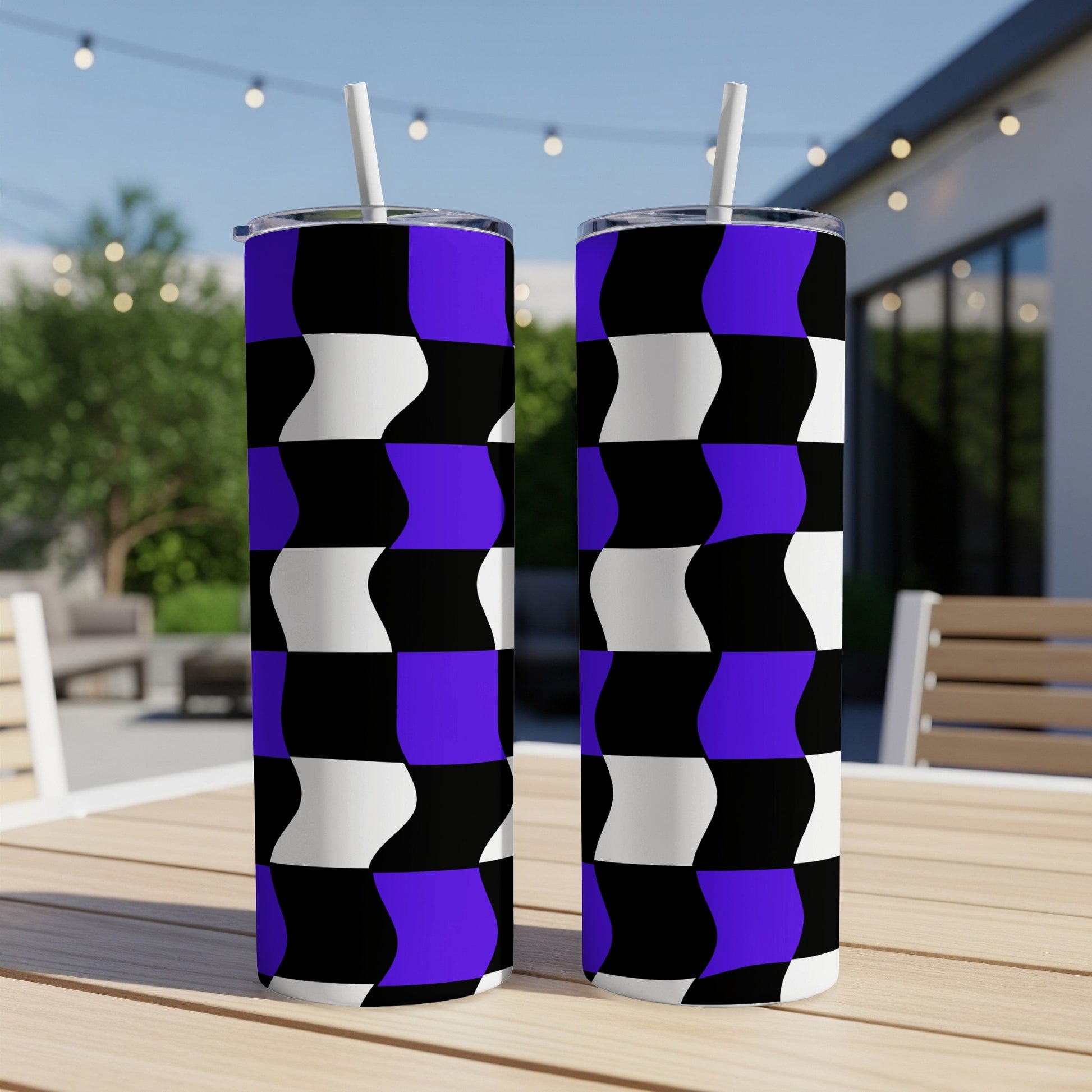 Two tall tumblers with a black, white, and purple checkered pattern.