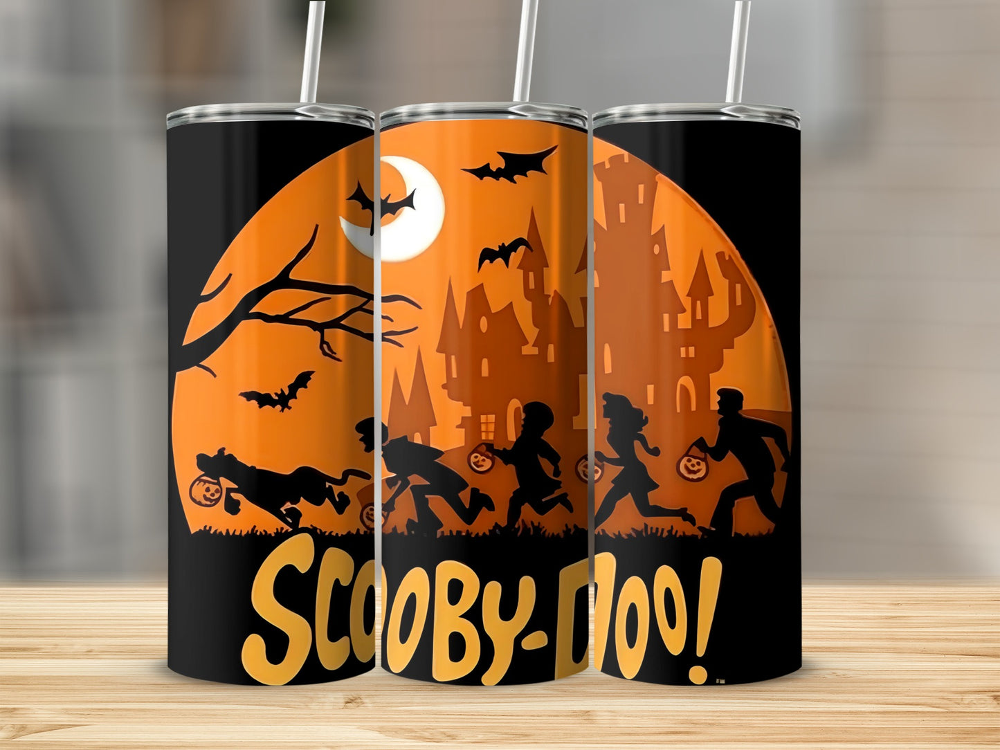 Scooby-Doo Halloween themed tumbler with silhouettes of characters and spooky castle.