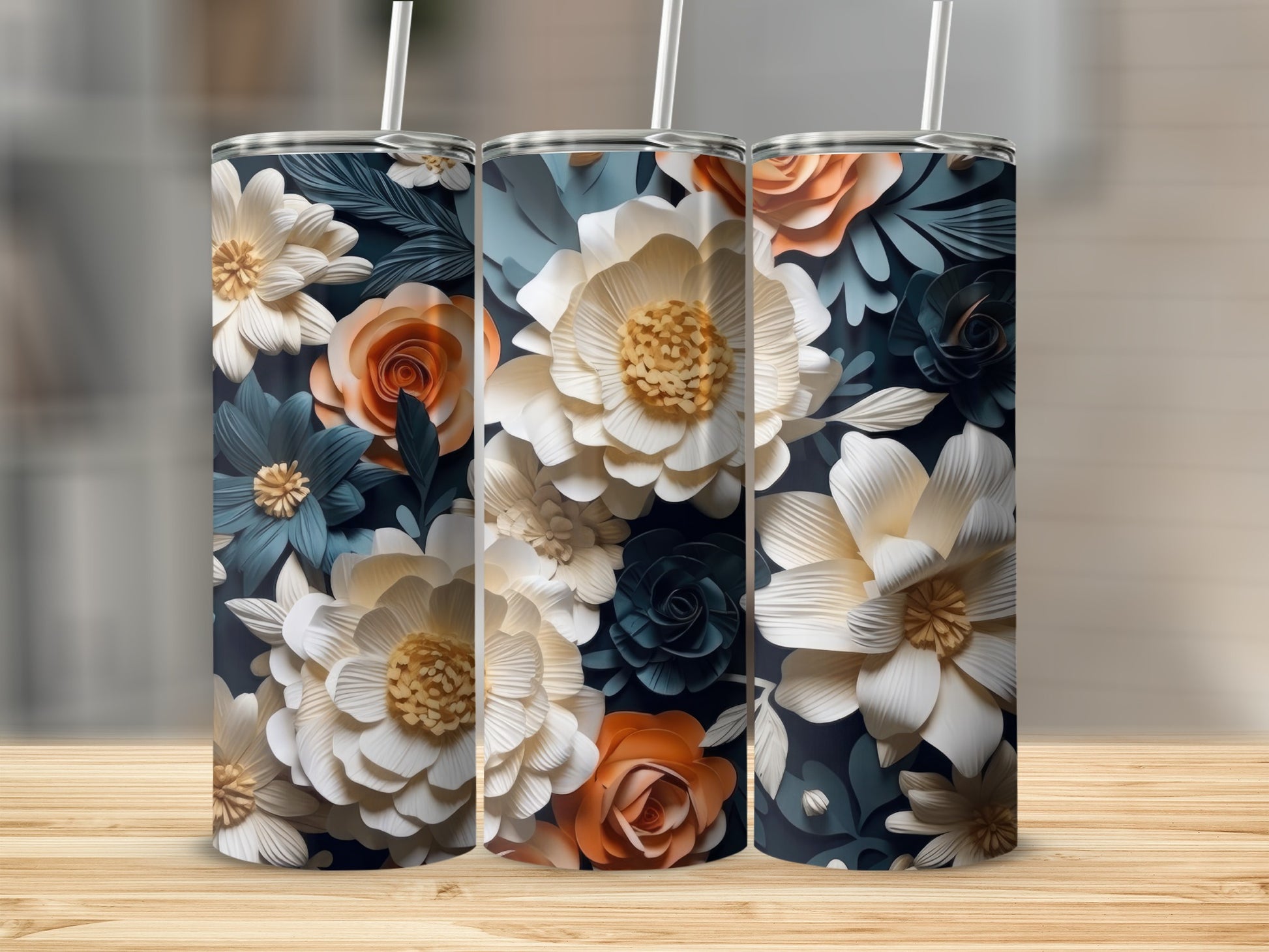 Three tumblers featuring a floral pattern of cream, white, and orange flowers.