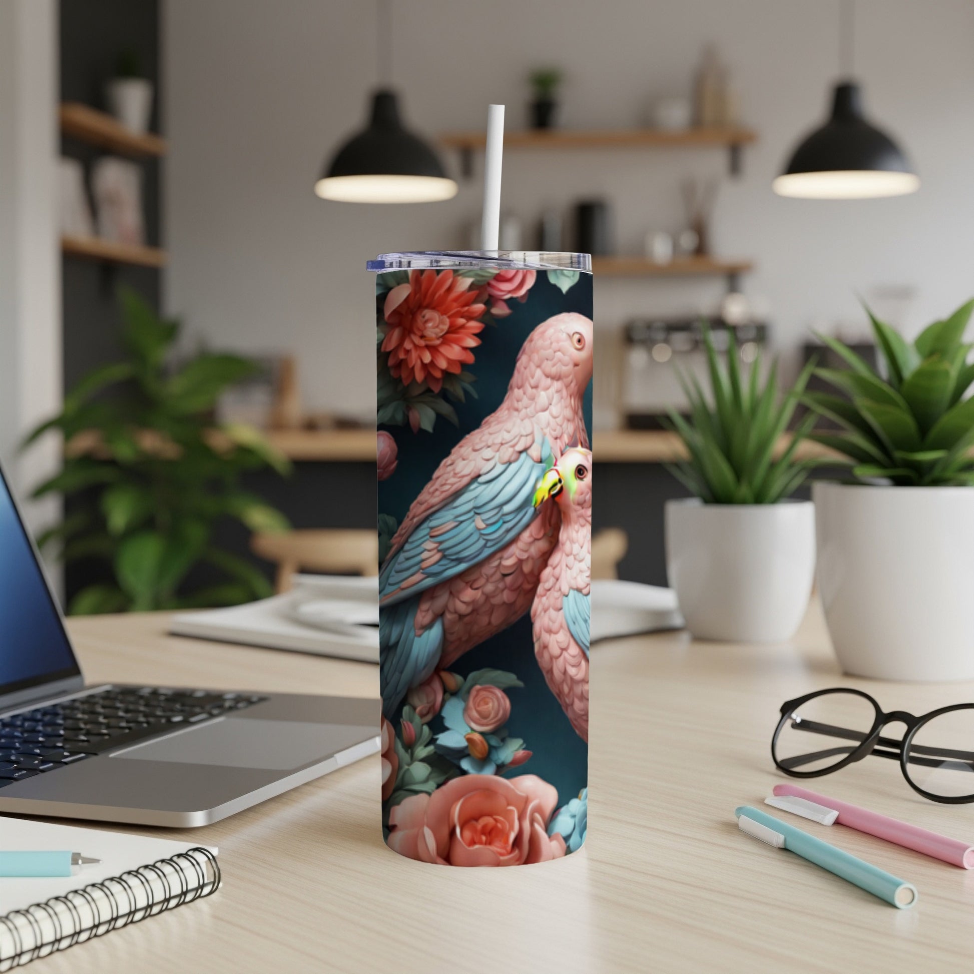 Two pink parrots with blue wings perched on floral stems, on a tumbler.
