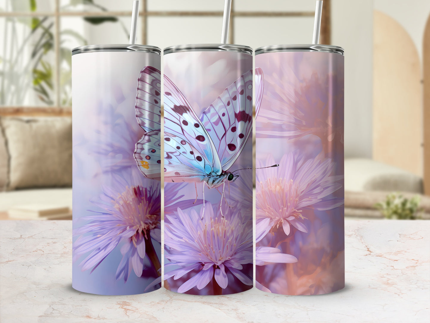 Three tumblers with a blue butterfly and purple flowers design.