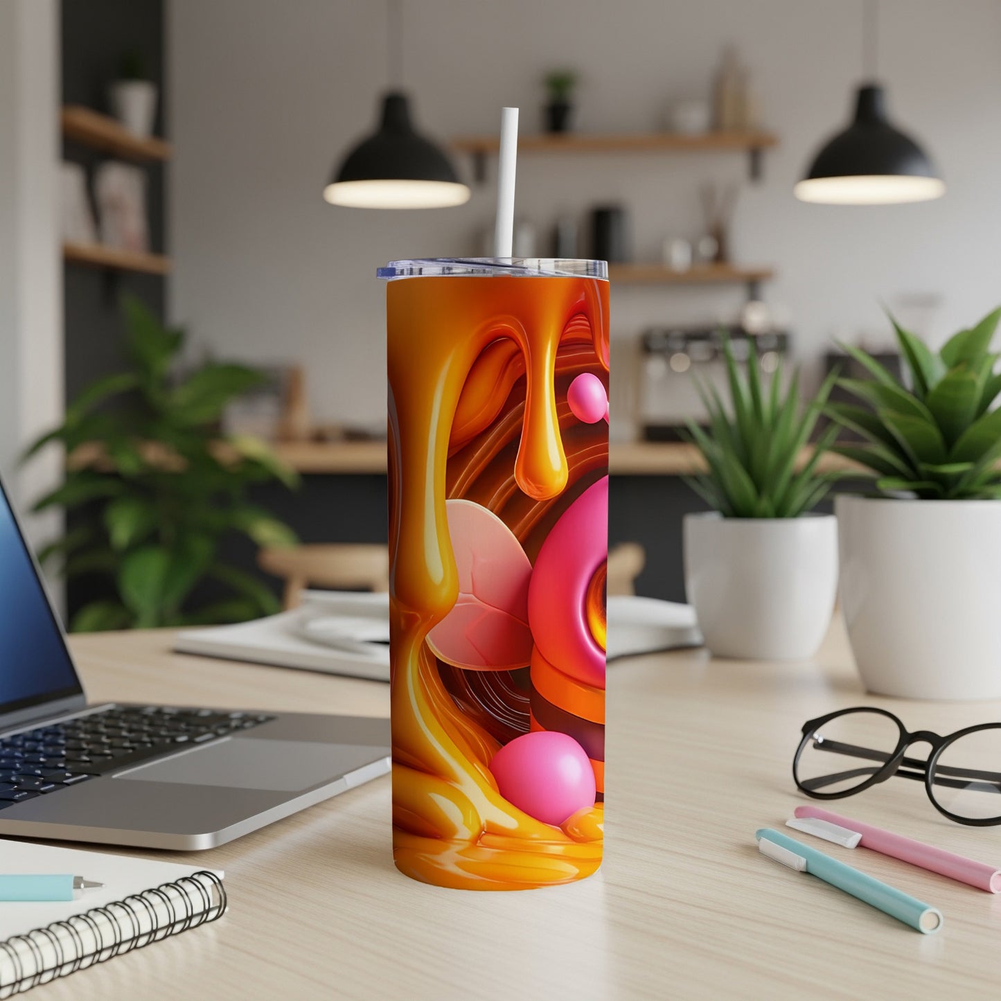 Abstract orange liquid art with pink bubble accents on a tumbler.