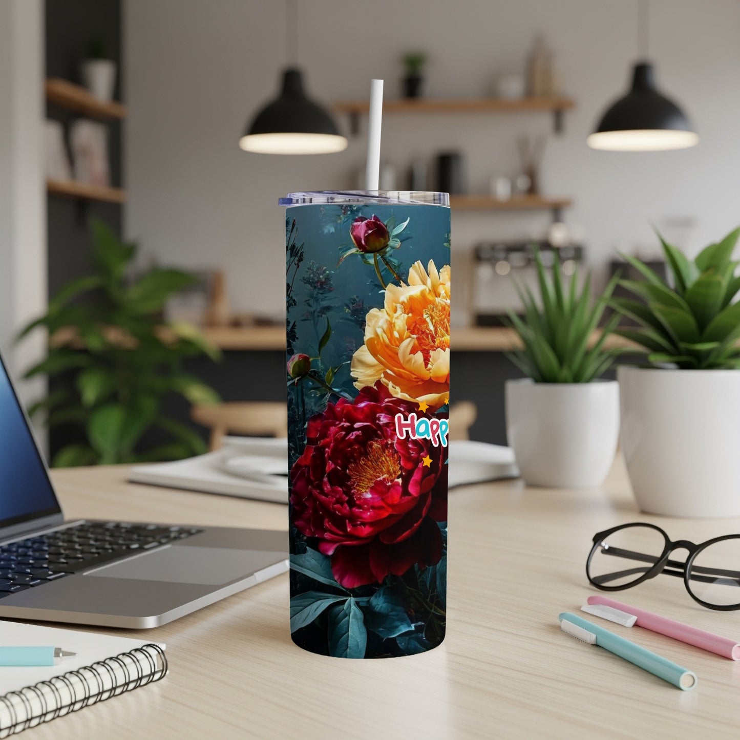 Tall tumbler with a floral design and "Happy" text.