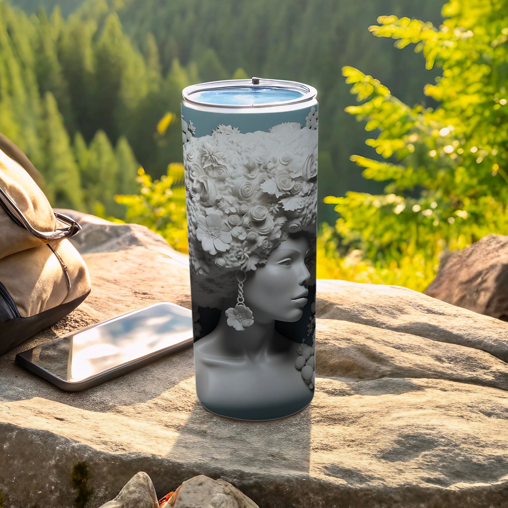 Tumbler featuring a woman's profile with a floral crown.