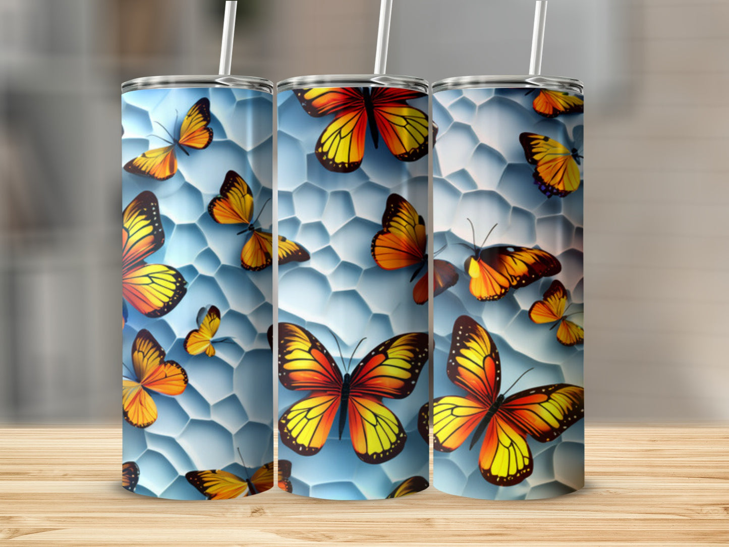 Three tumblers with colorful butterflies and honeycomb pattern.