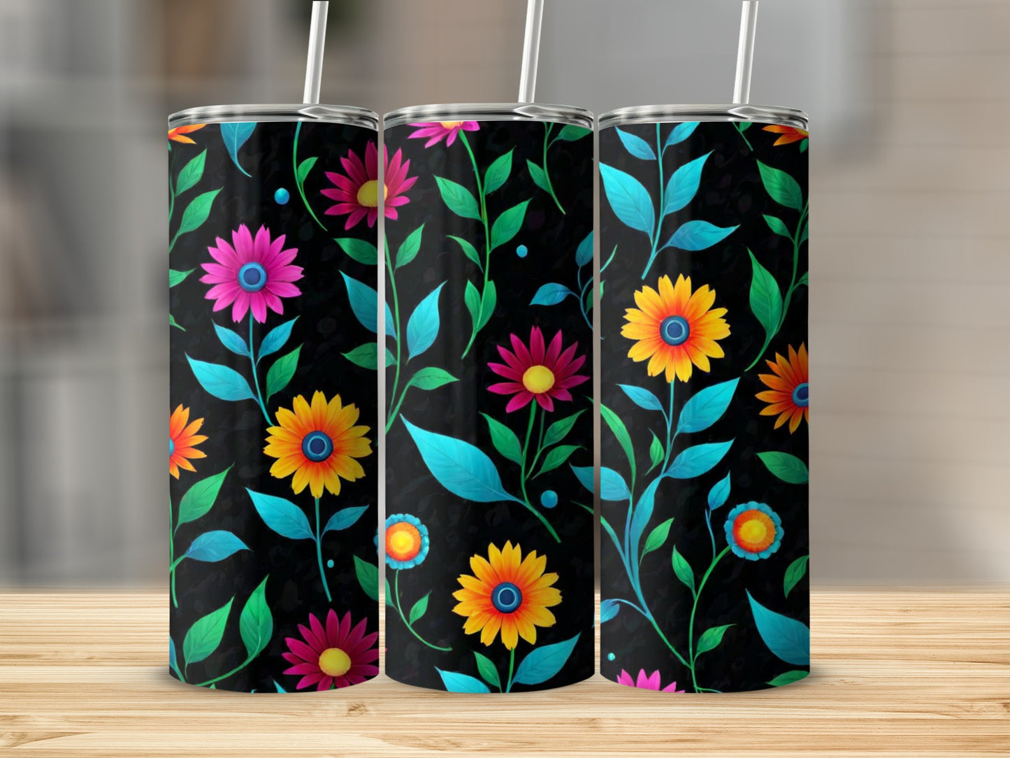 Three tumblers with a dark background and colorful floral pattern.