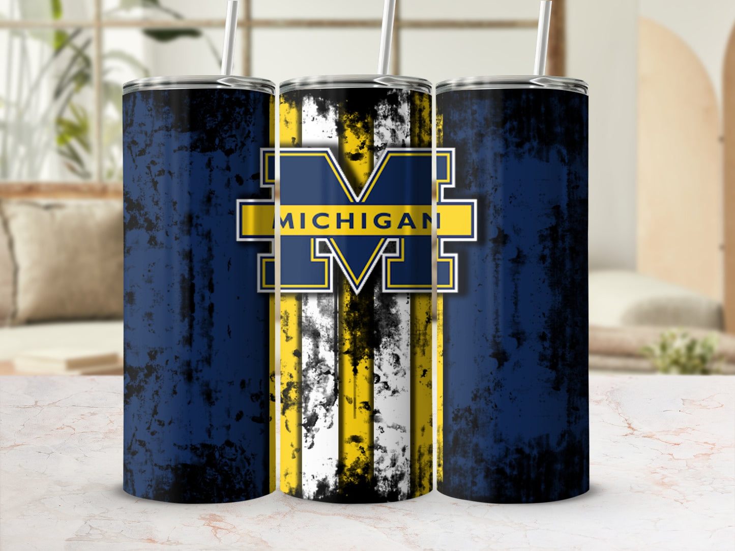 Three tumblers with Michigan Wolverines logo and distressed blue and yellow stripes.
