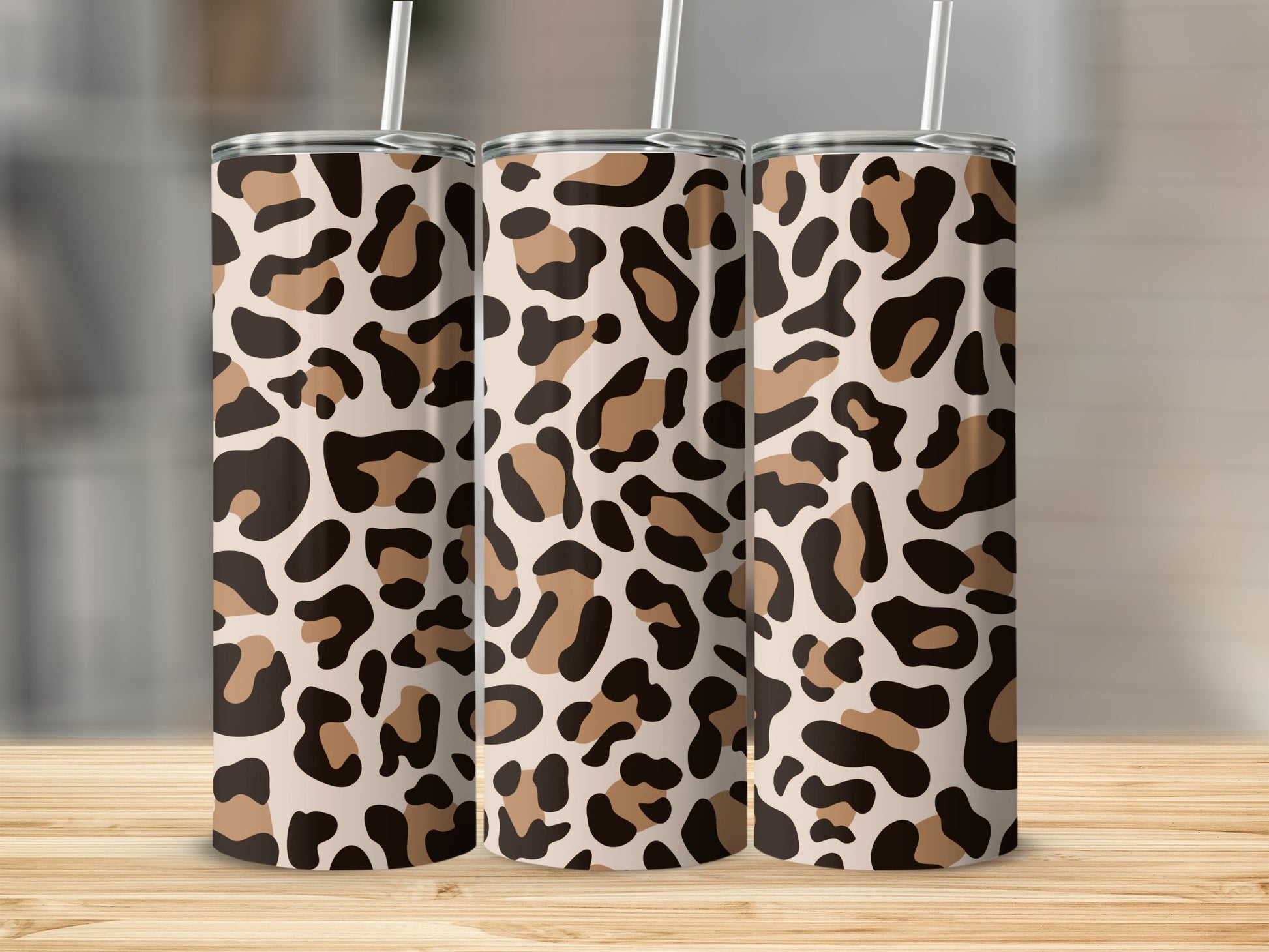Three tumblers with a beige, brown, and black leopard print pattern.
