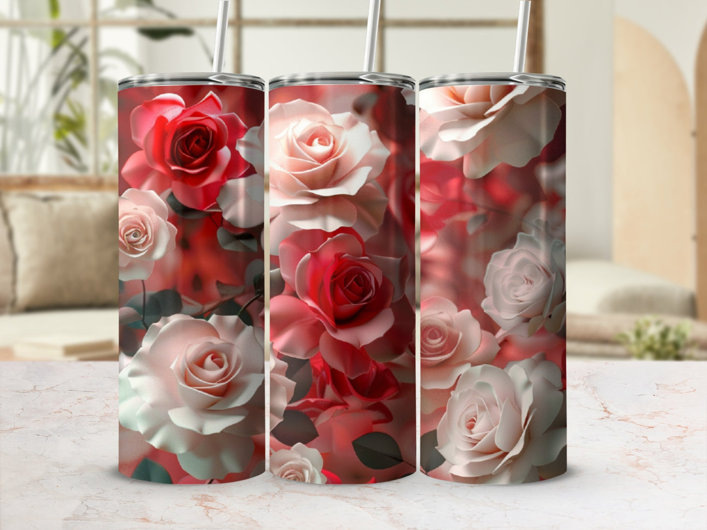 Three tumblers with a vibrant floral rose pattern on a marbled surface.