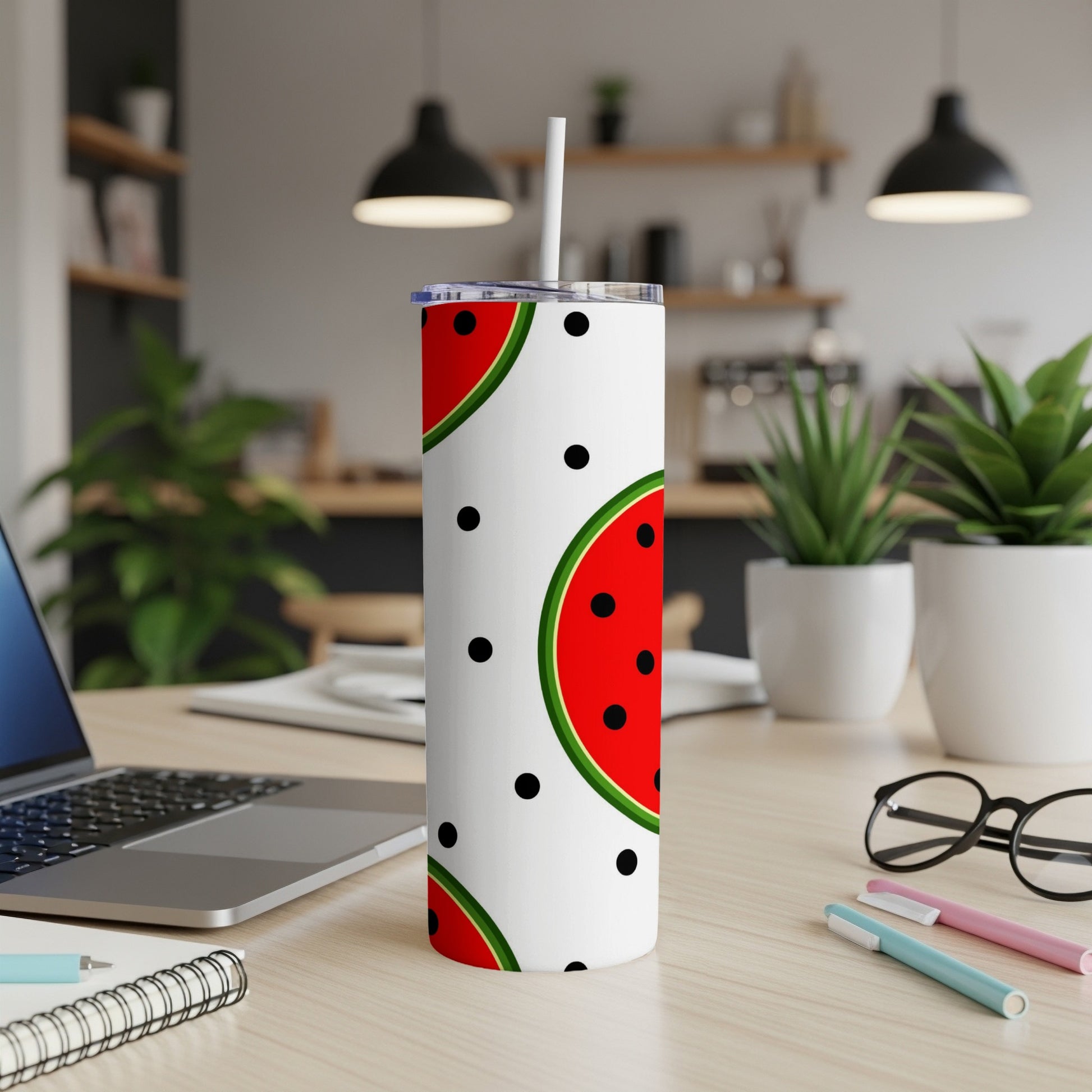 White tumbler with watermelon slices and black polka dots.