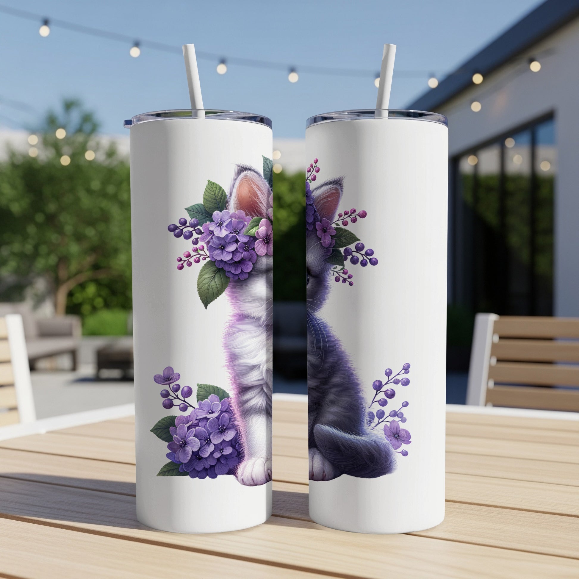 Two white tumblers featuring a grey cat adorned with purple flowers.
