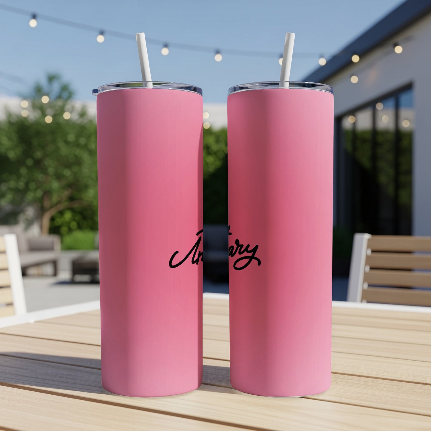Pink tumbler with "Artizary" in black script on it.