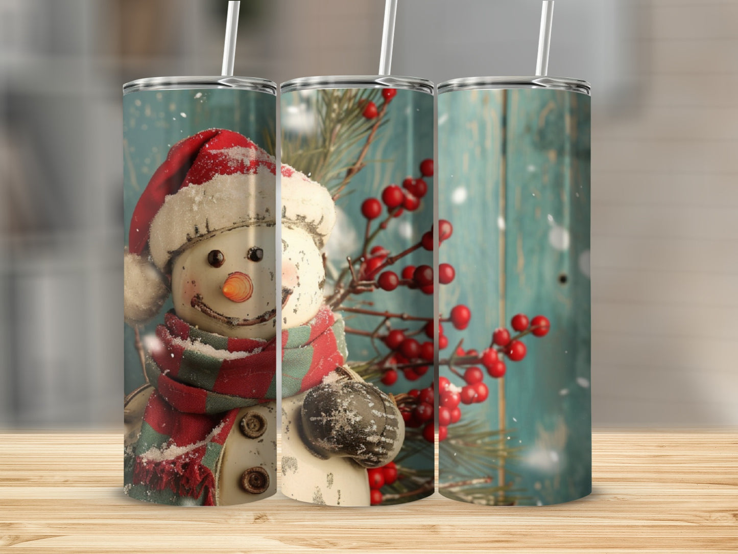 Three tumblers featuring a snowman with a red hat and green scarf.