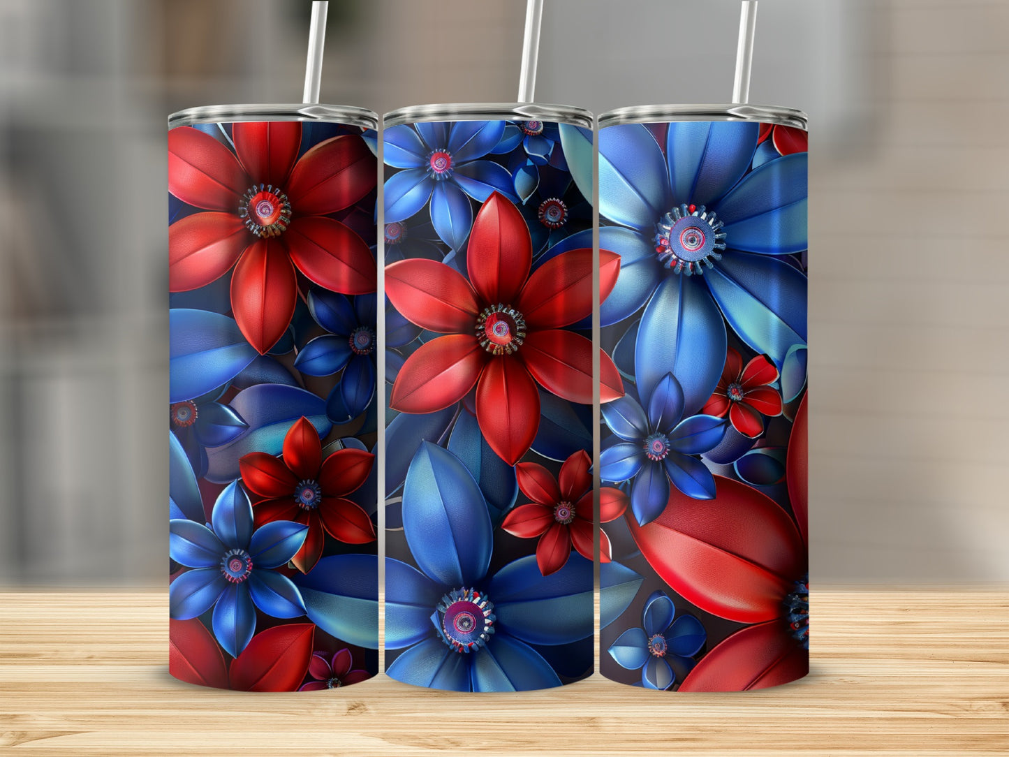 Three tumblers with a red and blue floral design on a wooden surface.
