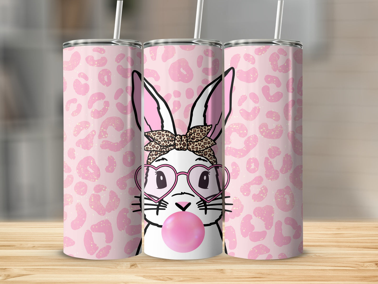 Bunny wearing heart glasses blowing pink bubblegum, leopard print background.