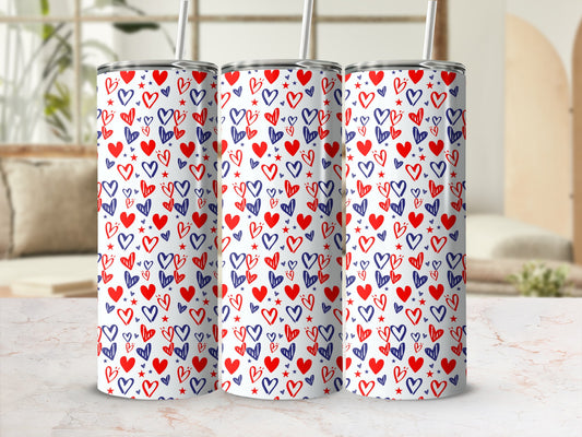 Three tumblers with a repeating pattern of blue and red hearts.