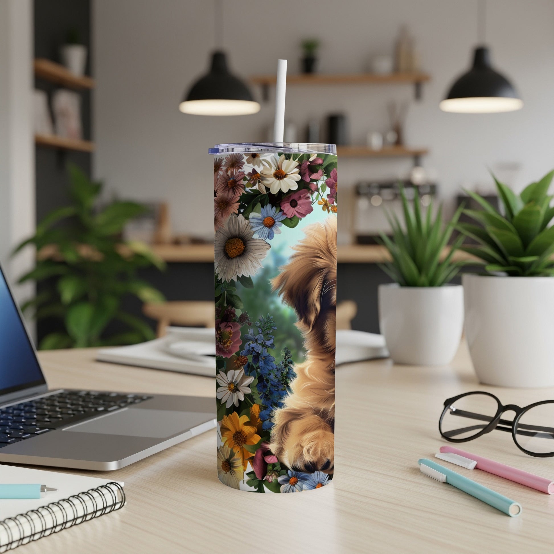 Dog with floral pattern on a tumbler on a desk.