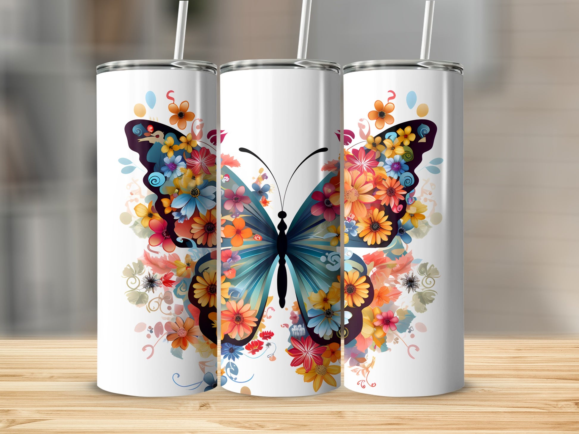 Three tumblers featuring a vibrant butterfly and floral design.