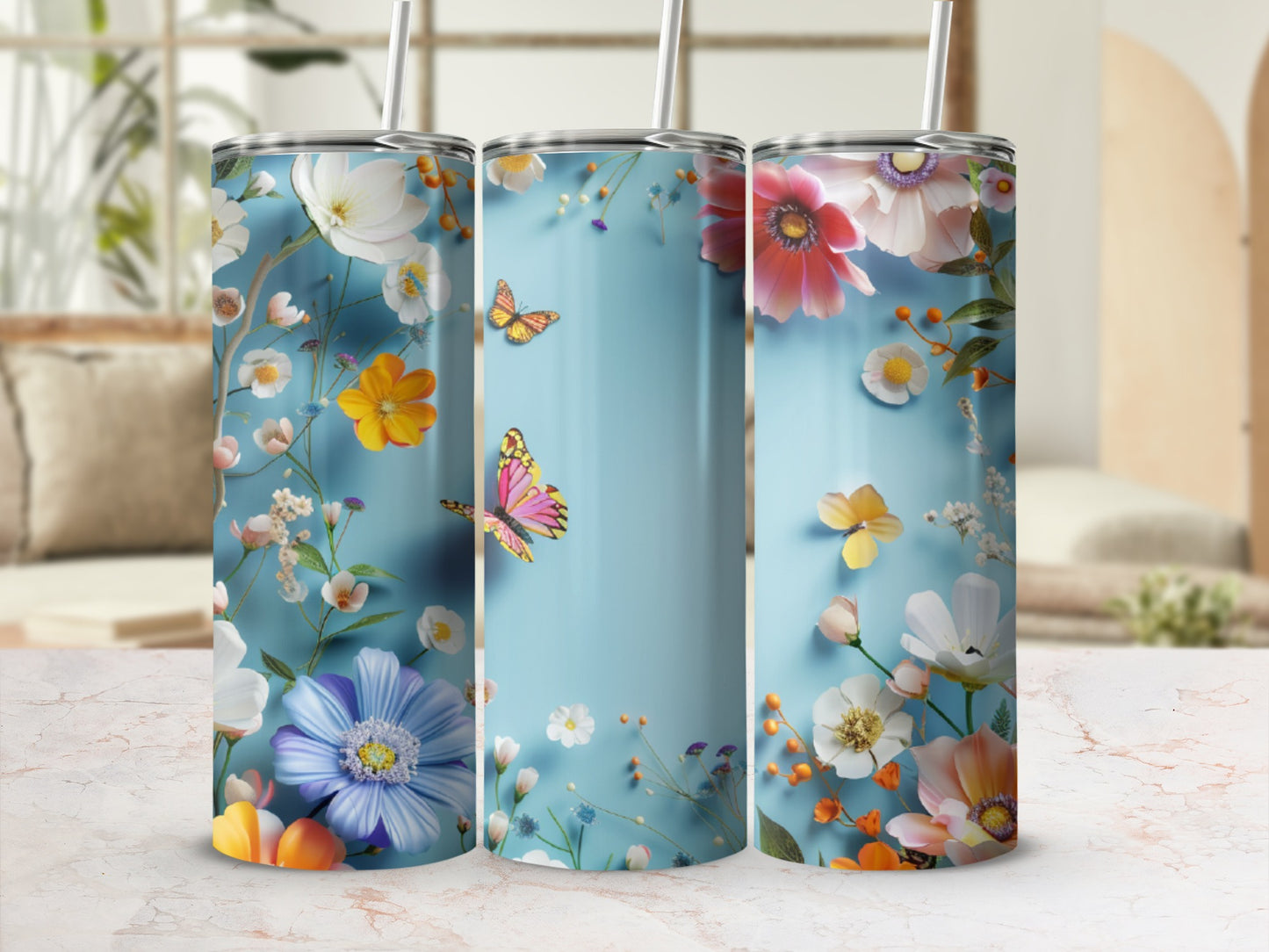 Blue tumbler with floral and butterfly design.