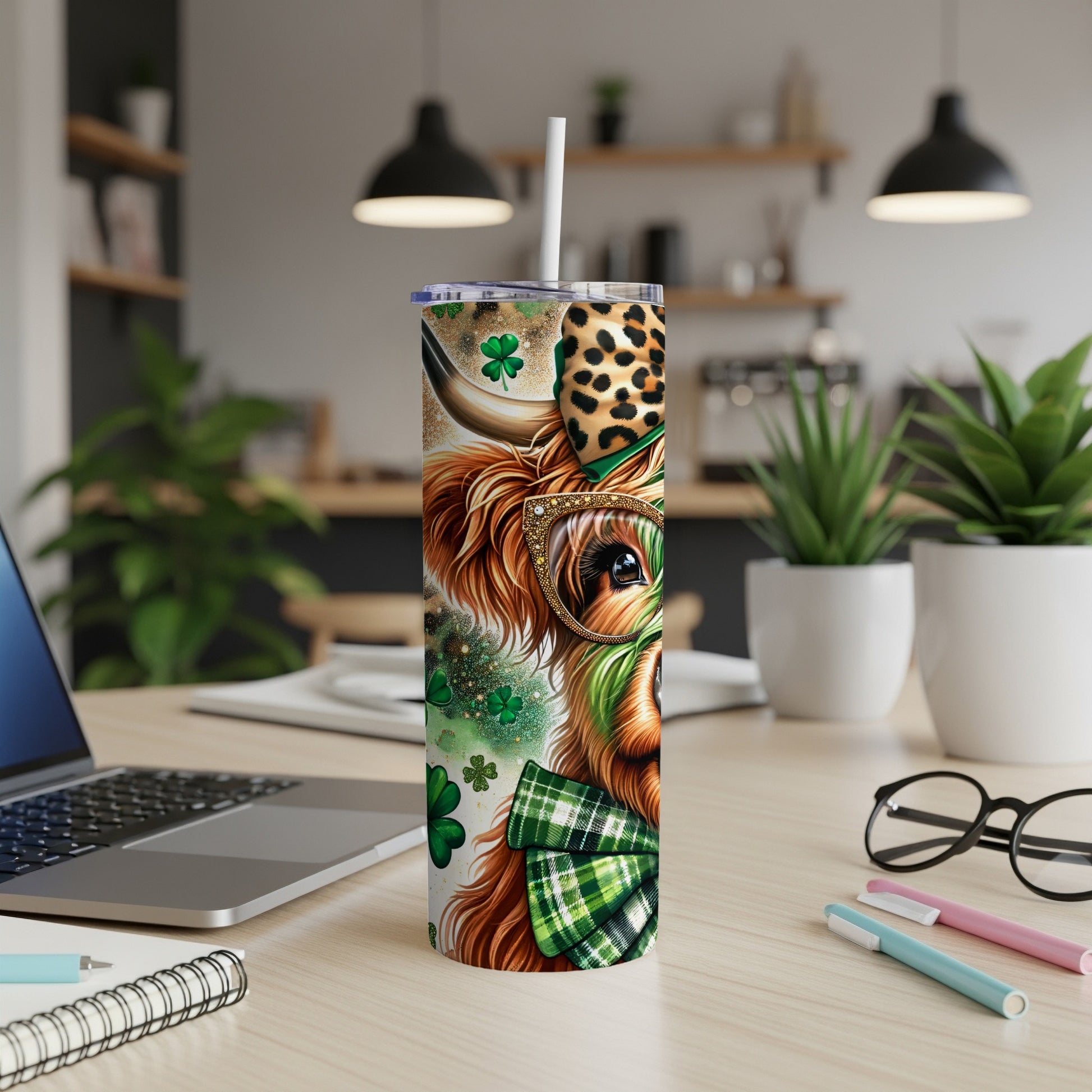 Cow wearing glasses and a bow tie, with shamrocks on a tumbler.