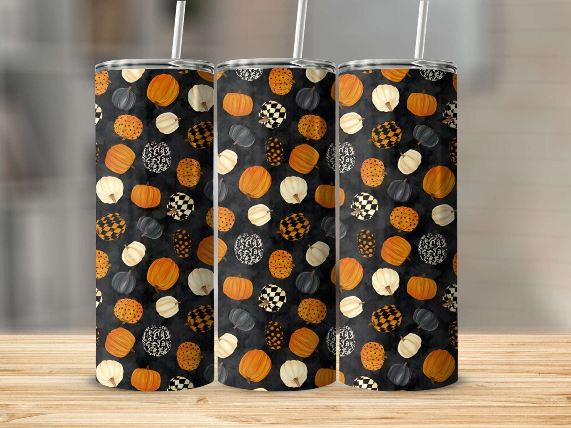 Three tumblers with a Halloween pumpkin and checkerboard pattern.
