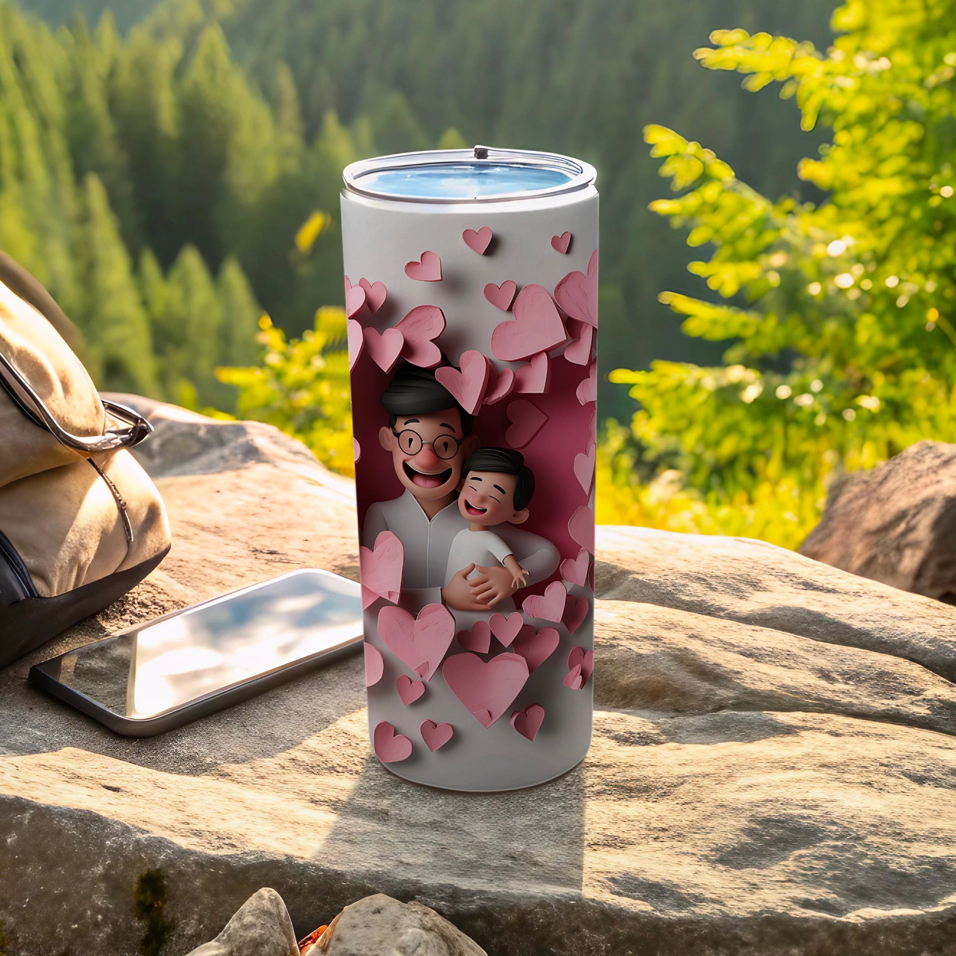 Tumbler with father and son hugging surrounded by pink hearts.