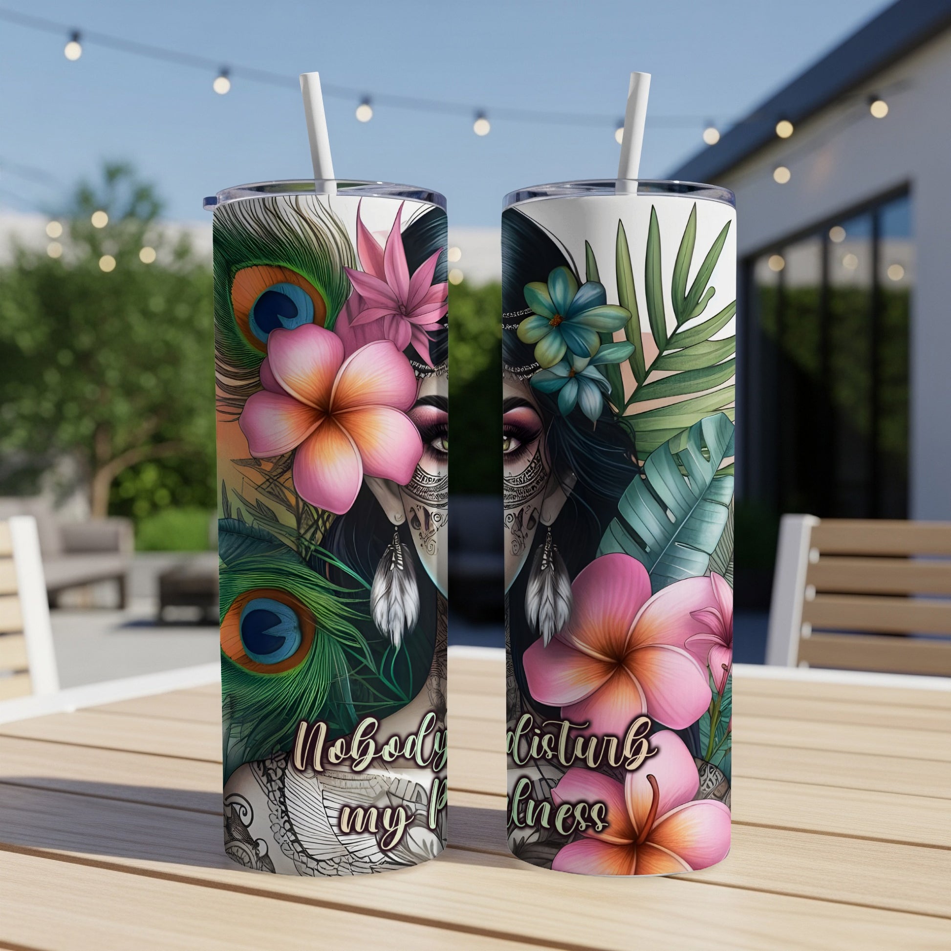 Tumbler with tropical flowers, peacock feathers, and "Nobody disturb my bliss" text.