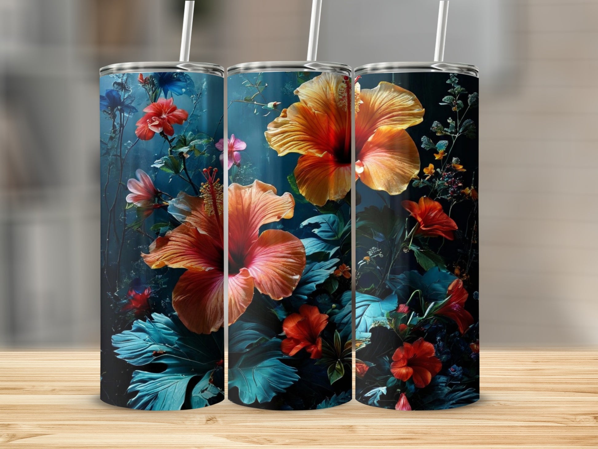Three tumblers with vibrant floral hibiscus and leafy designs.