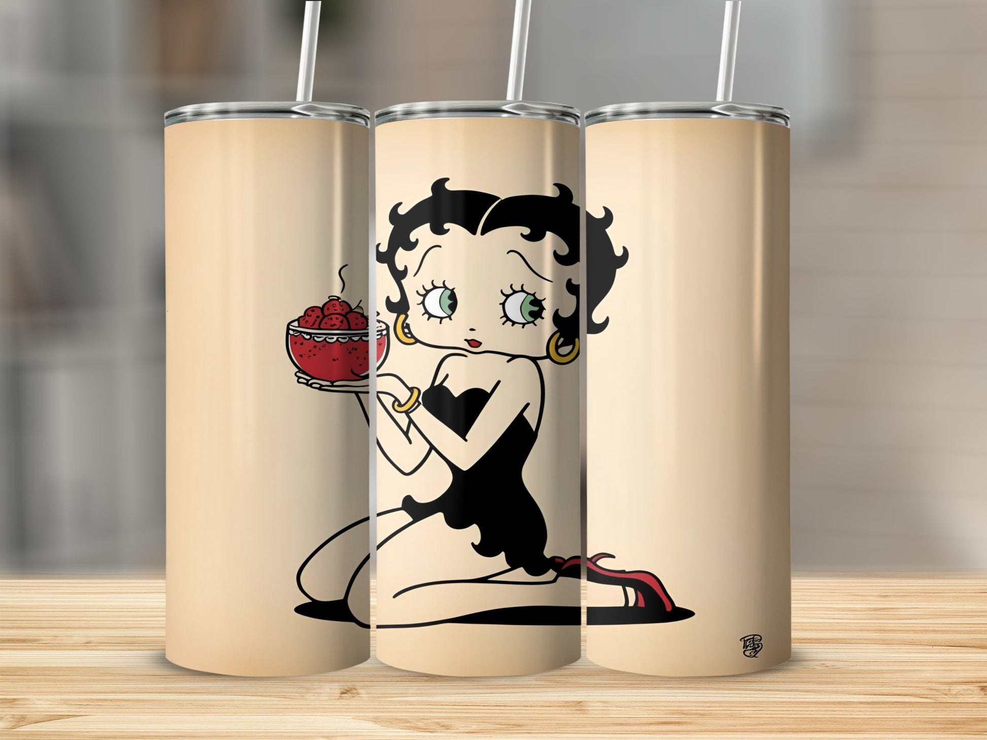 Betty Boop sitting with a bowl of strawberries.