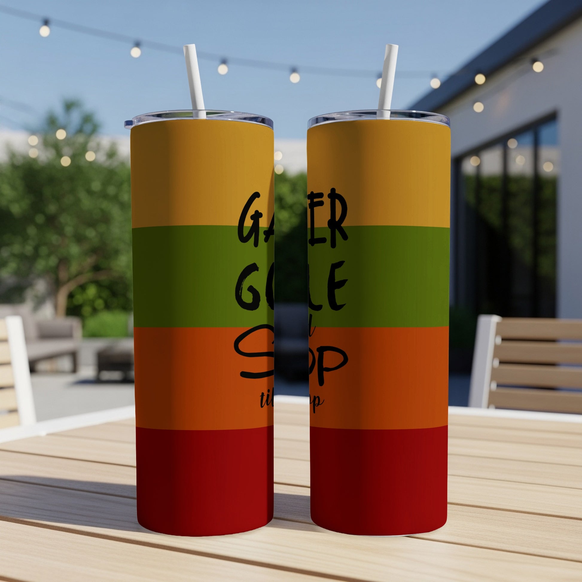 Two tumblers with "Gamer, Golfer, Stop" text on striped background.