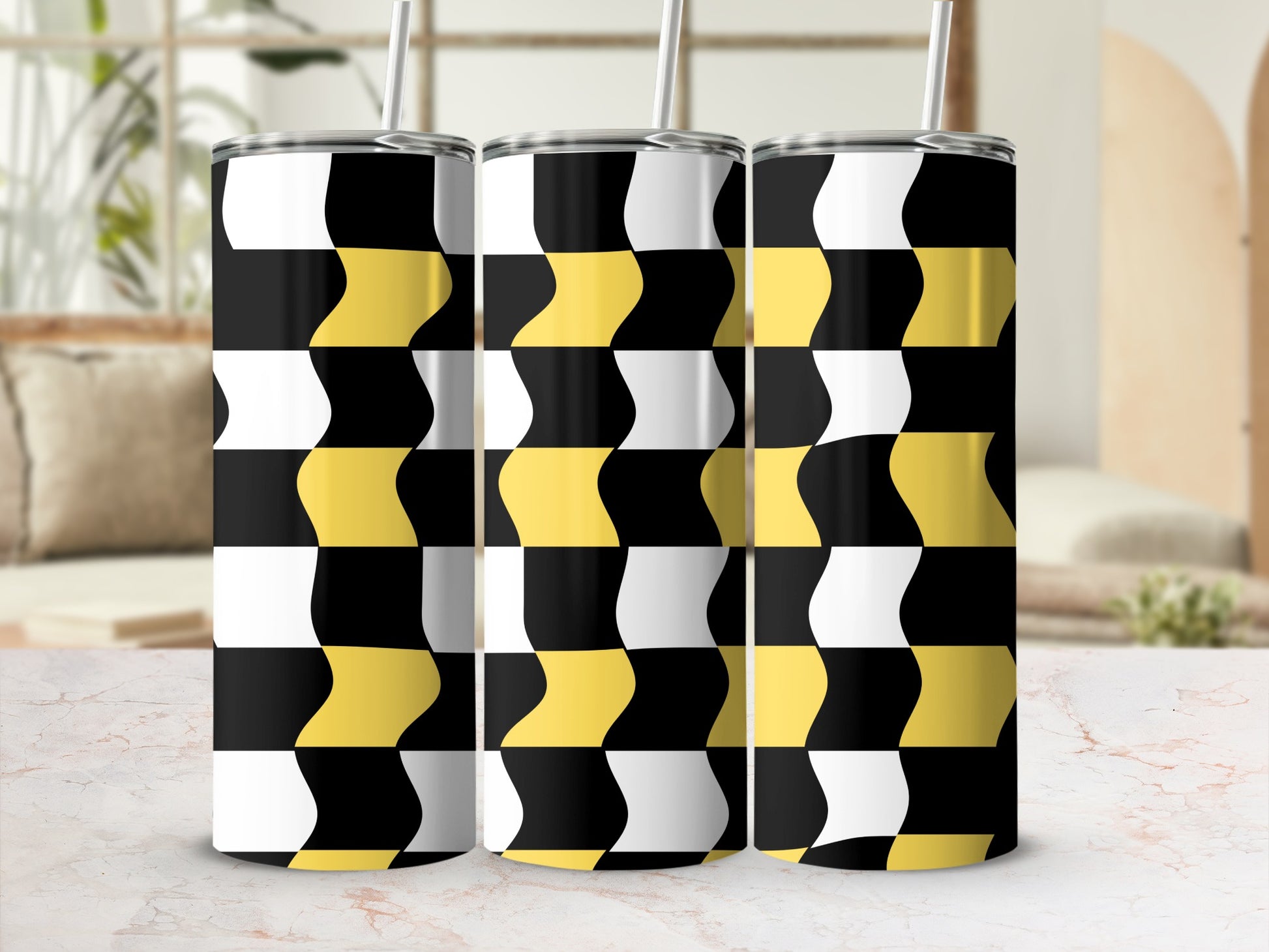 Three tumblers with a black, white, and yellow geometric wave pattern.