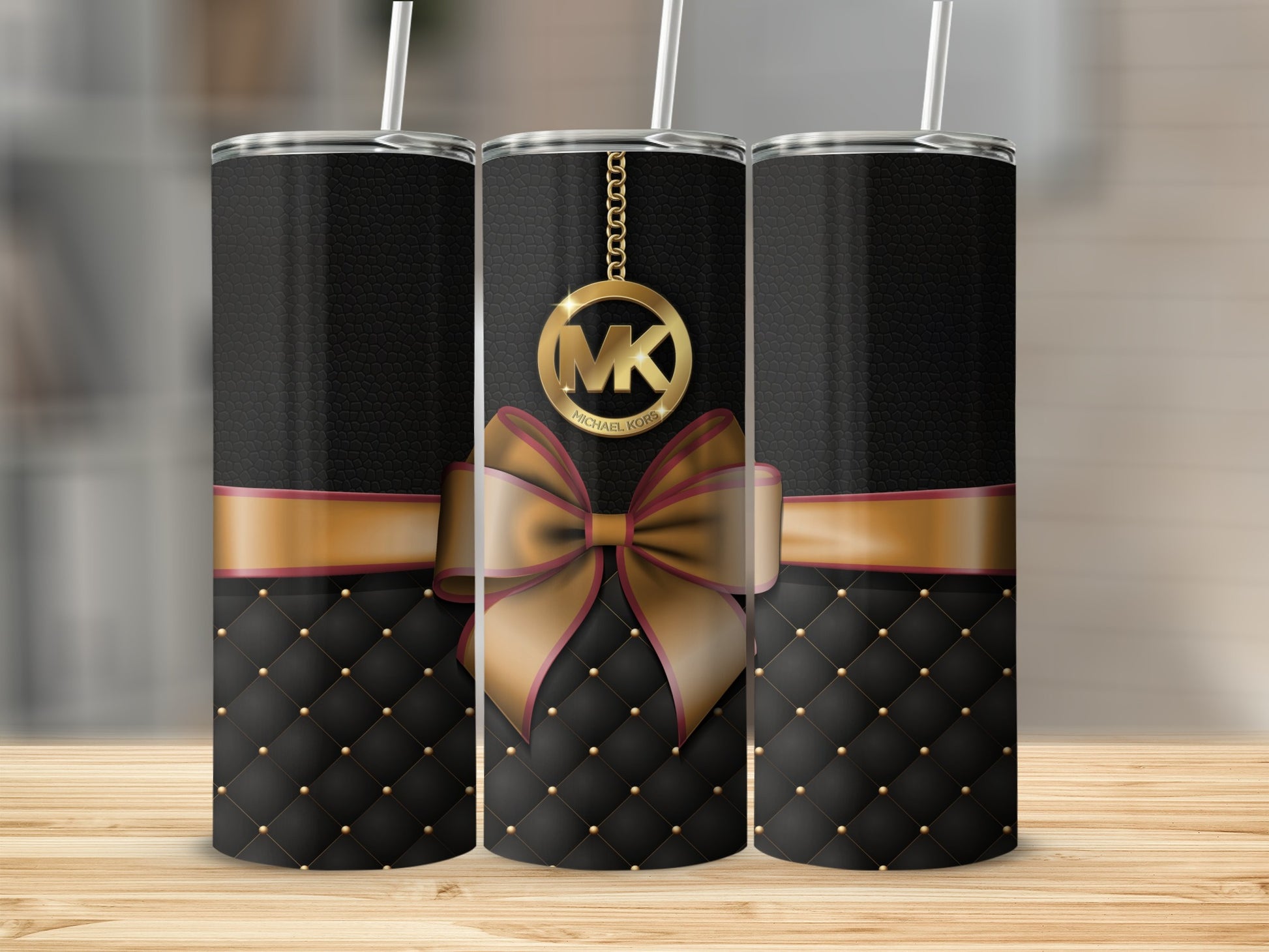 Elegant Black Tumbler with Gold Ribbon Pattern Design