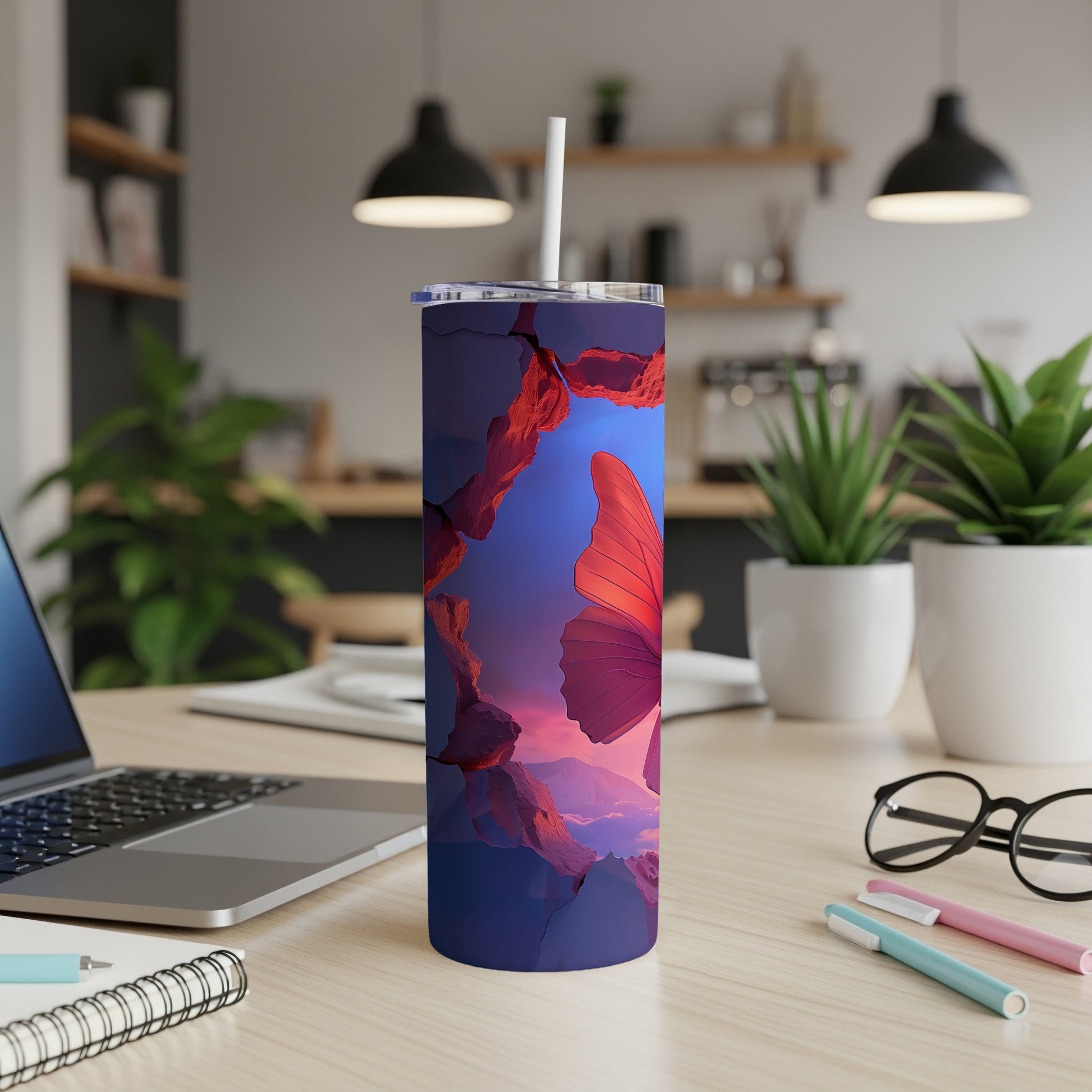 Purple tumbler with a large, red butterfly and red rock formations.