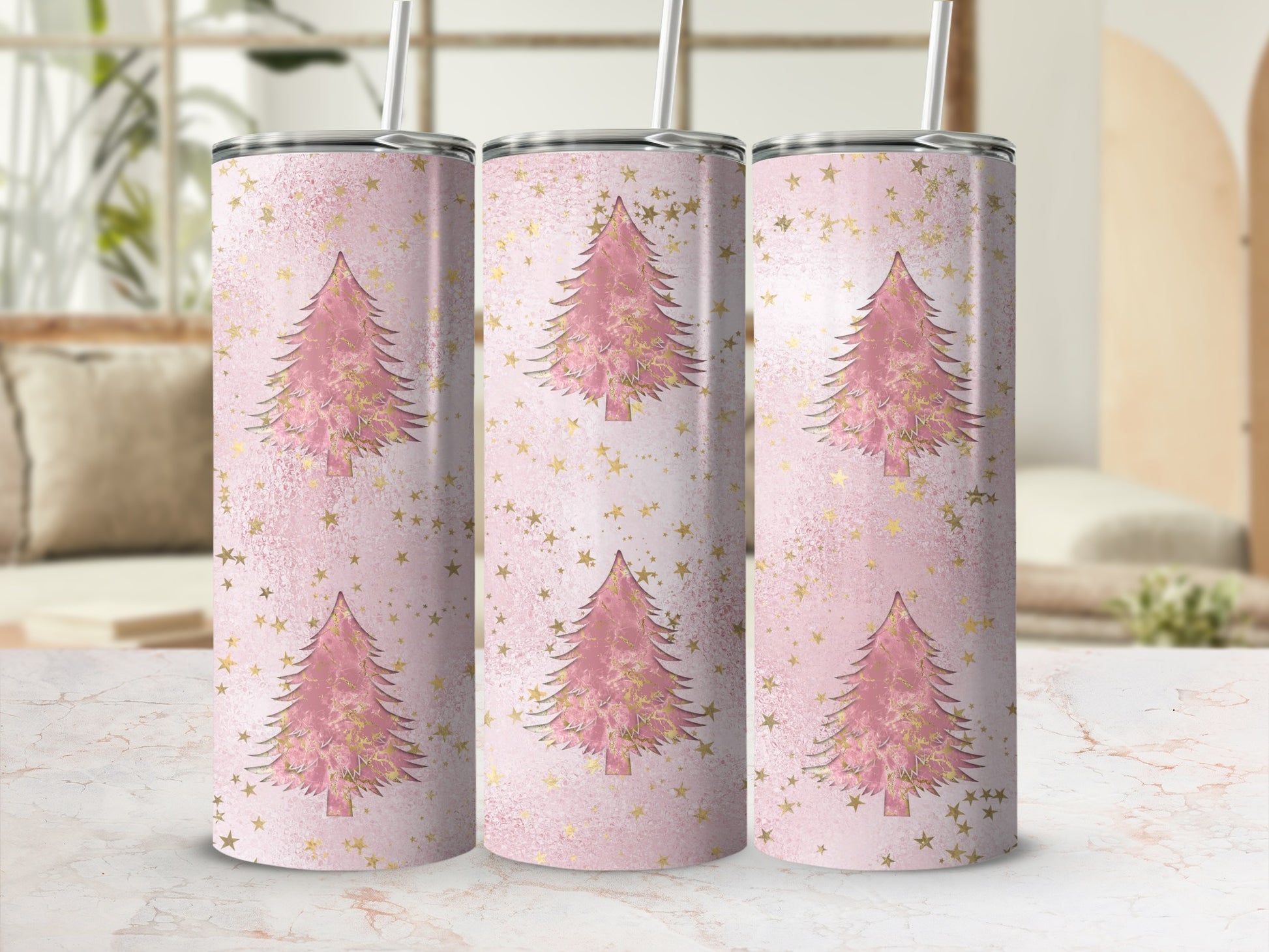 Pink Christmas tree pattern on a skinny tumbler with gold stars.
