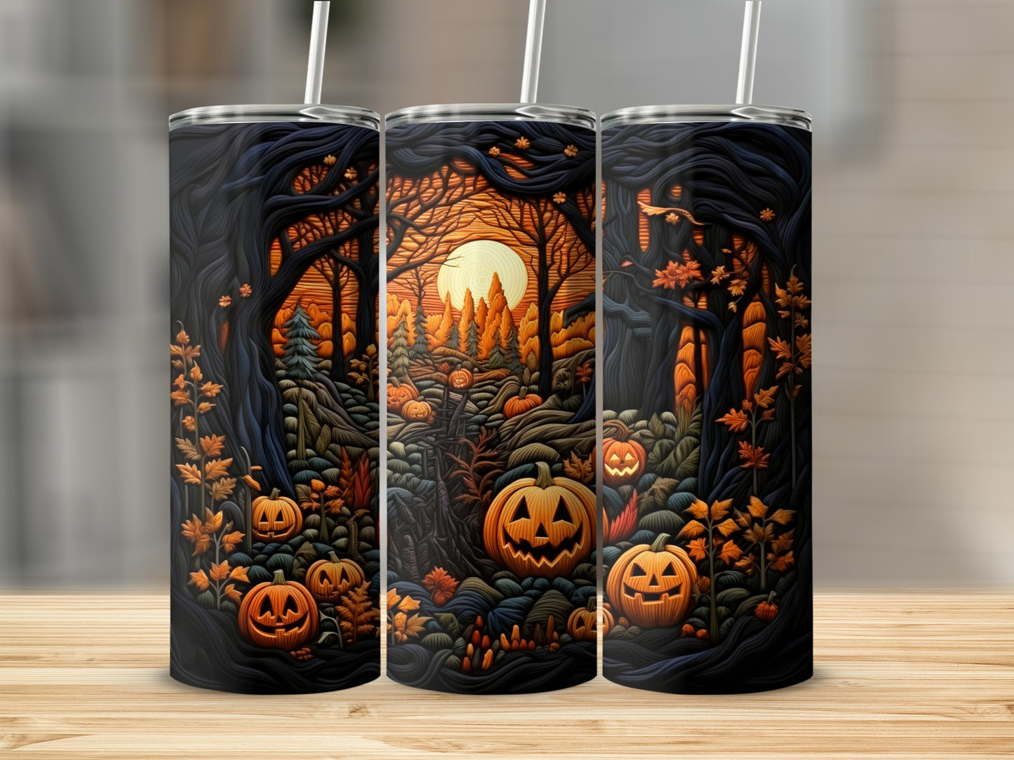Three tumblers featuring a dark forest scene with jack-o'-lanterns and a moonlit sky.