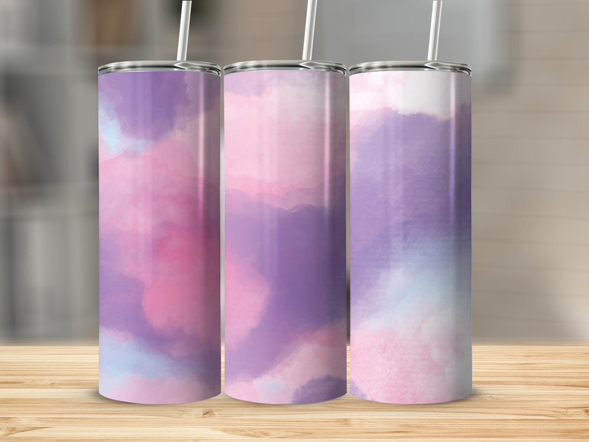 Three tumblers with abstract purple, pink, and blue watercolor designs.