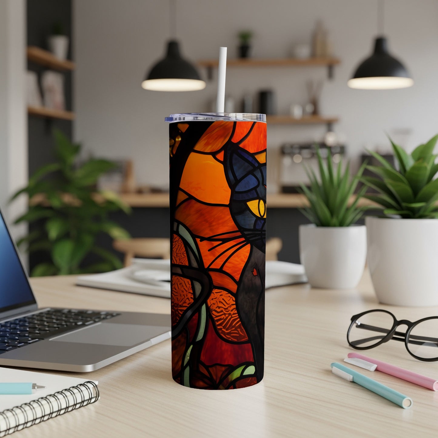 Black cat in stained glass pattern on a tumbler with a straw.