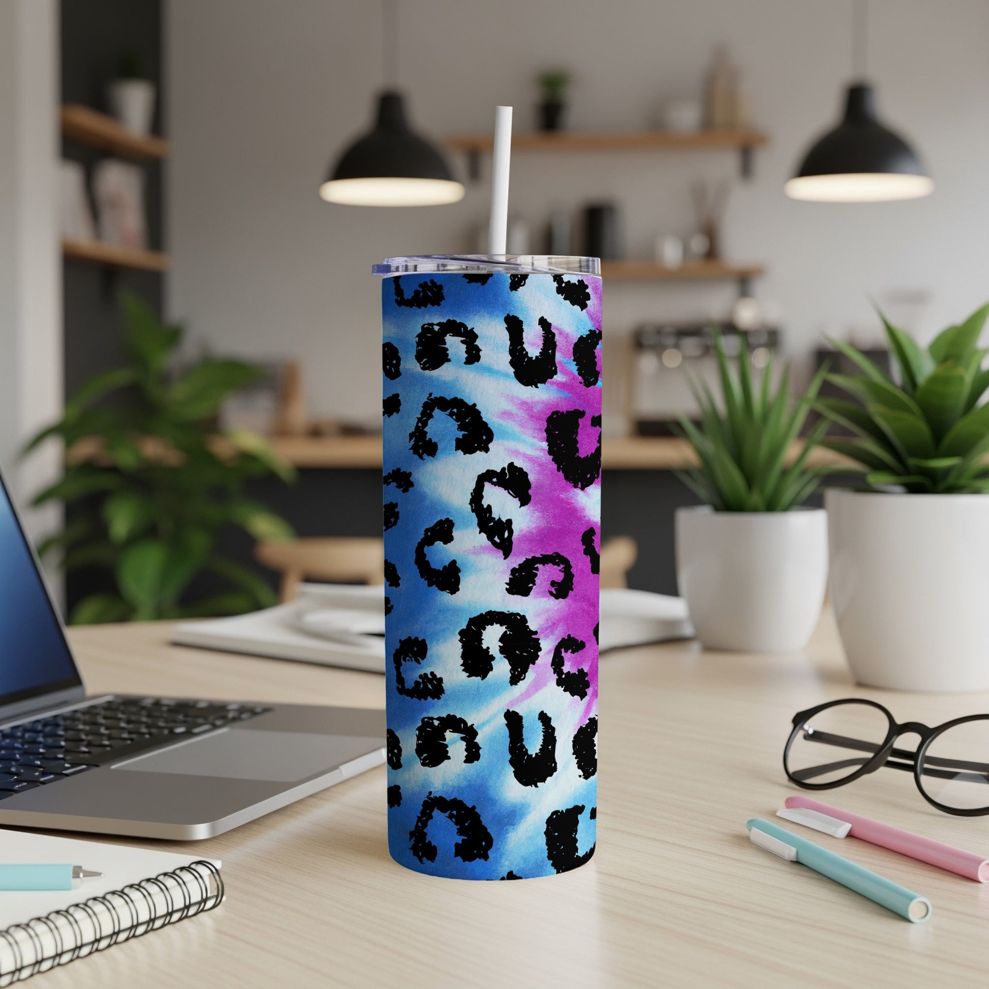 Tumbler with blue and pink tie-dye and black leopard print pattern.
