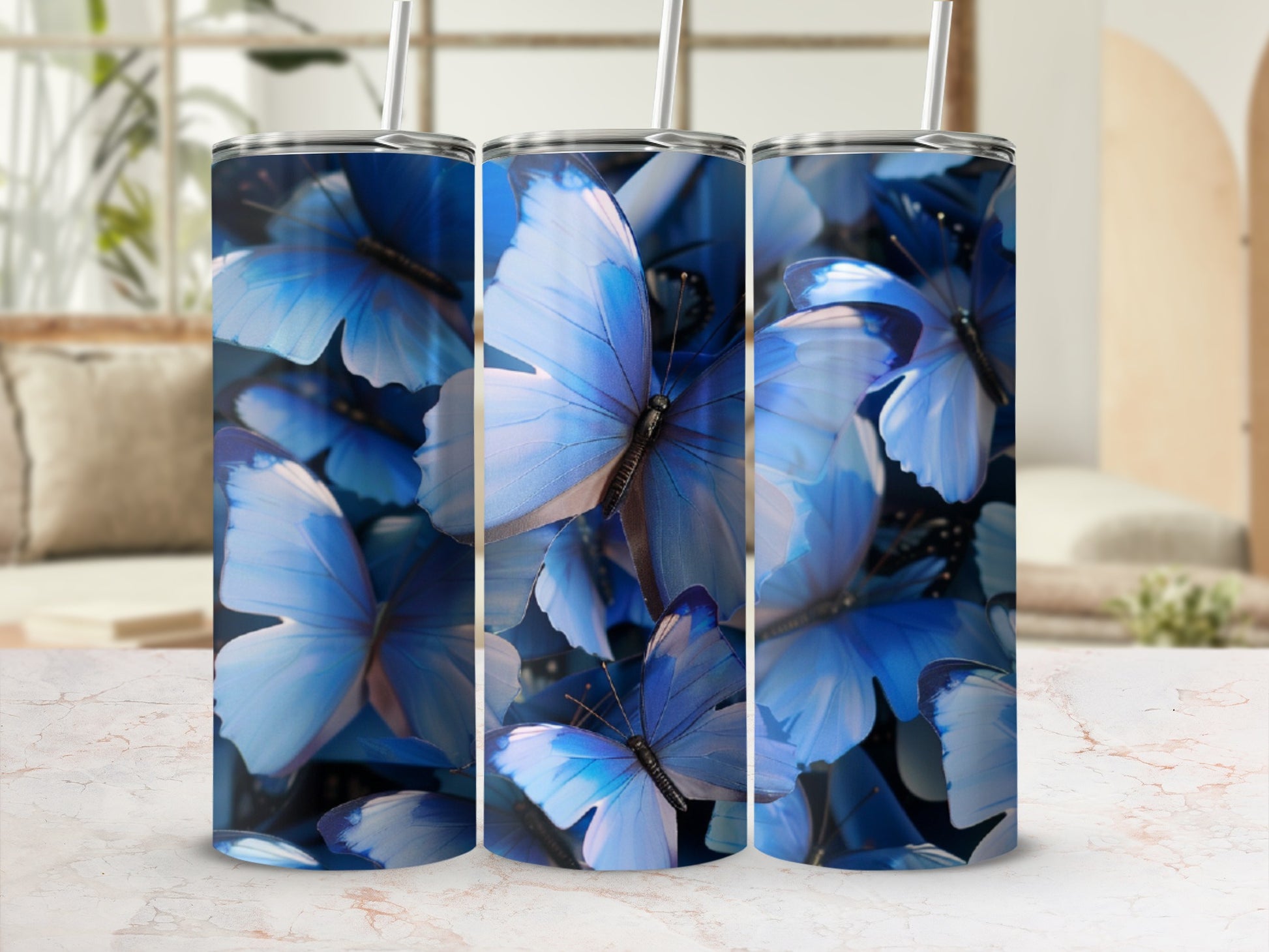 Three tumblers with a close-up blue butterfly design.