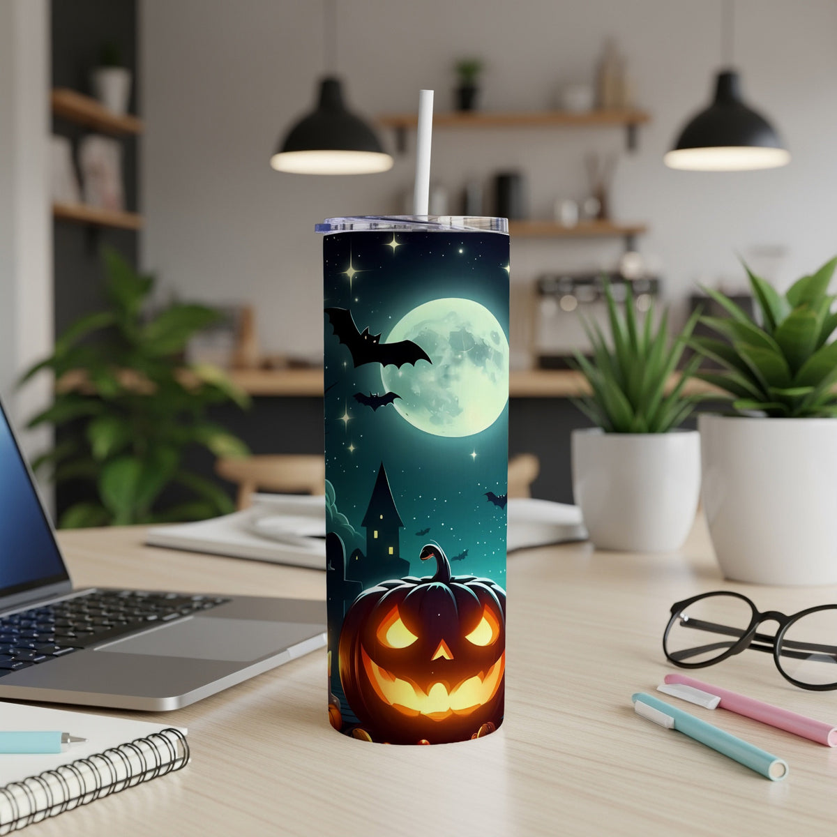 Halloween tumbler with jack-o'-lantern, bats, haunted house, and moon.