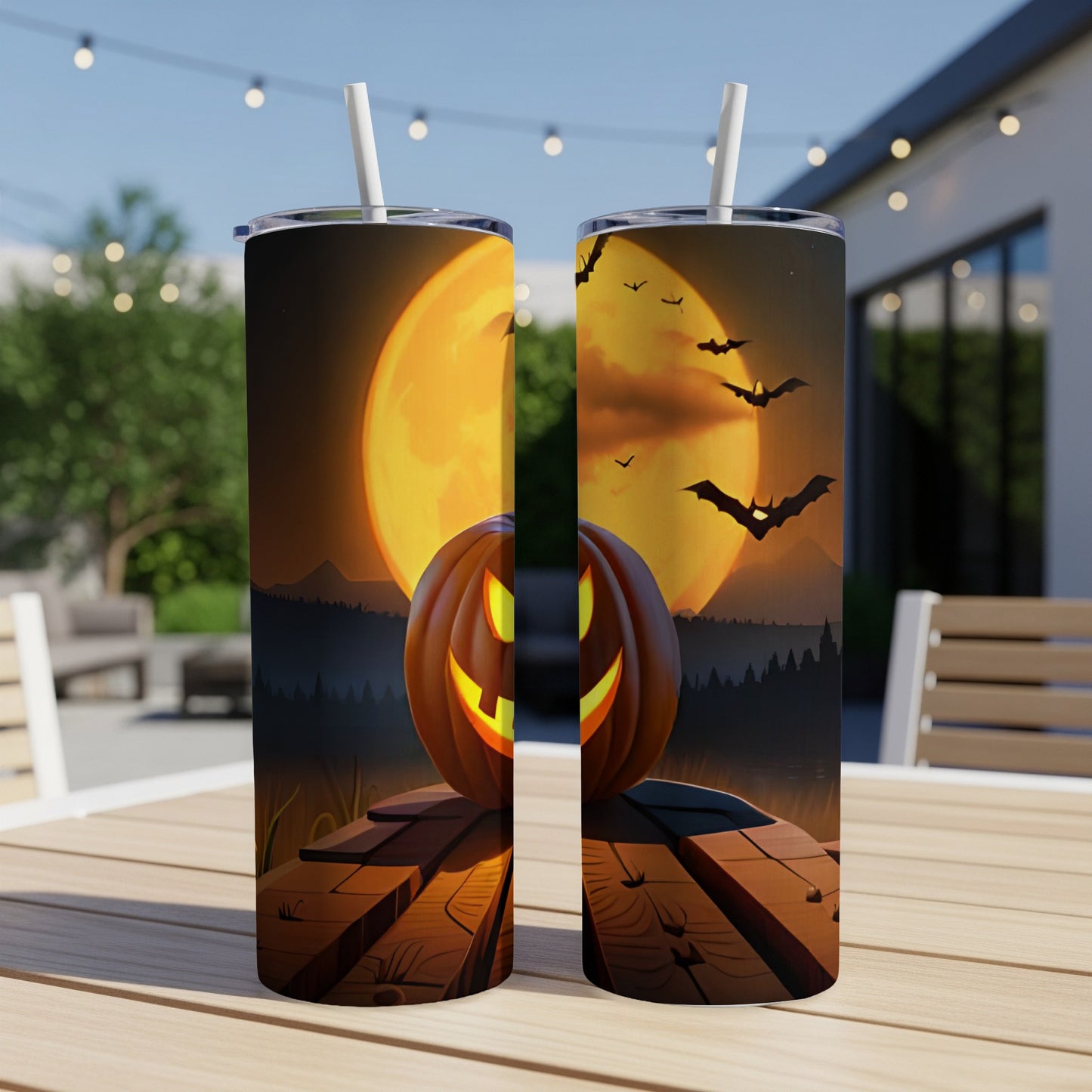 Two tumblers with Halloween design of a jack-o'-lantern, full moon, and bats.