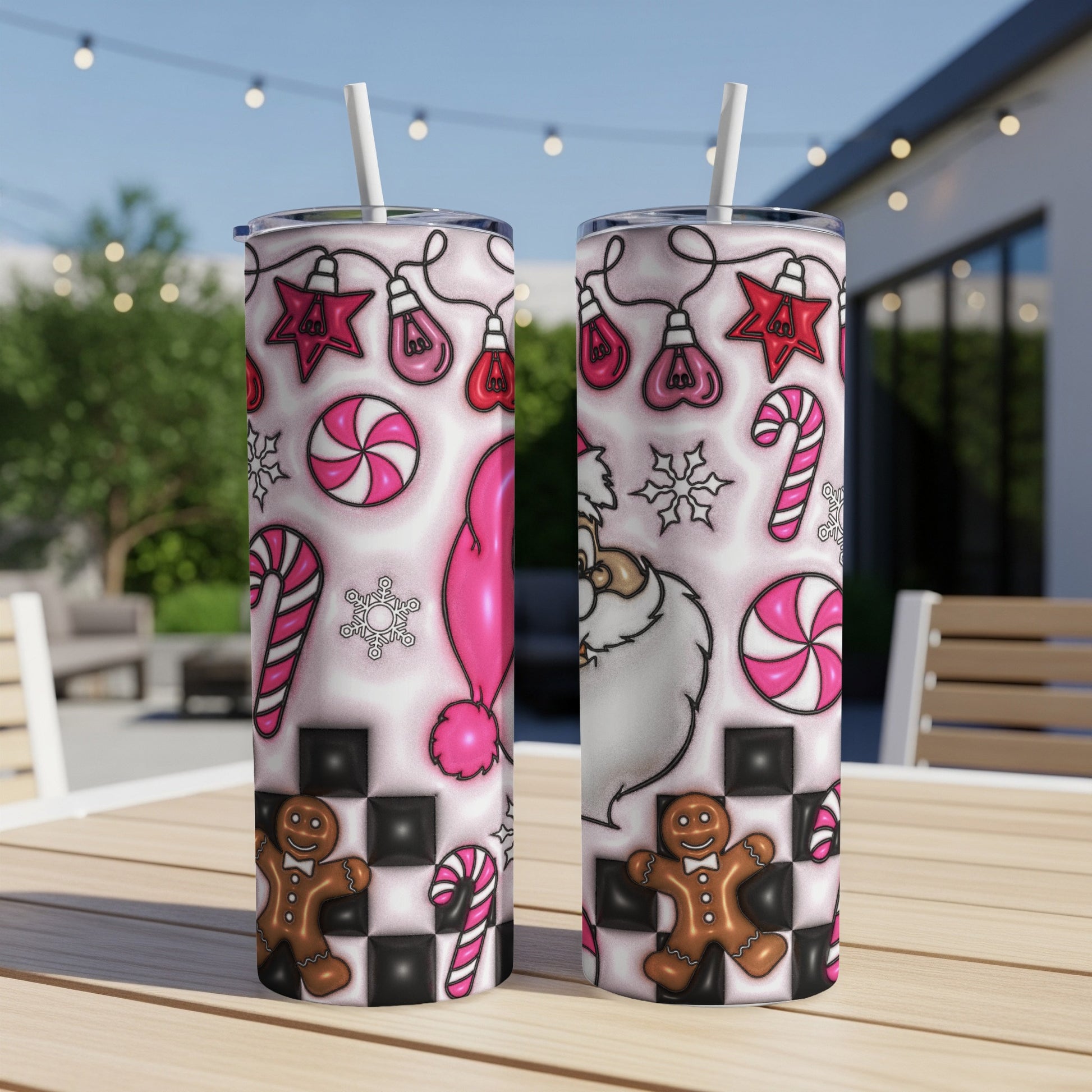 Two Santa-themed tumblers with Christmas and candy designs on a checkered background.