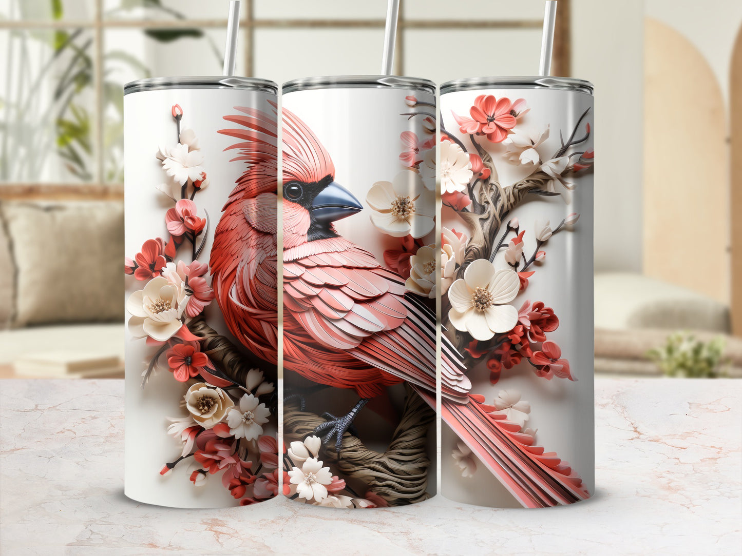 Three tumblers featuring a detailed cardinal perched on a branch with pink and white flowers.