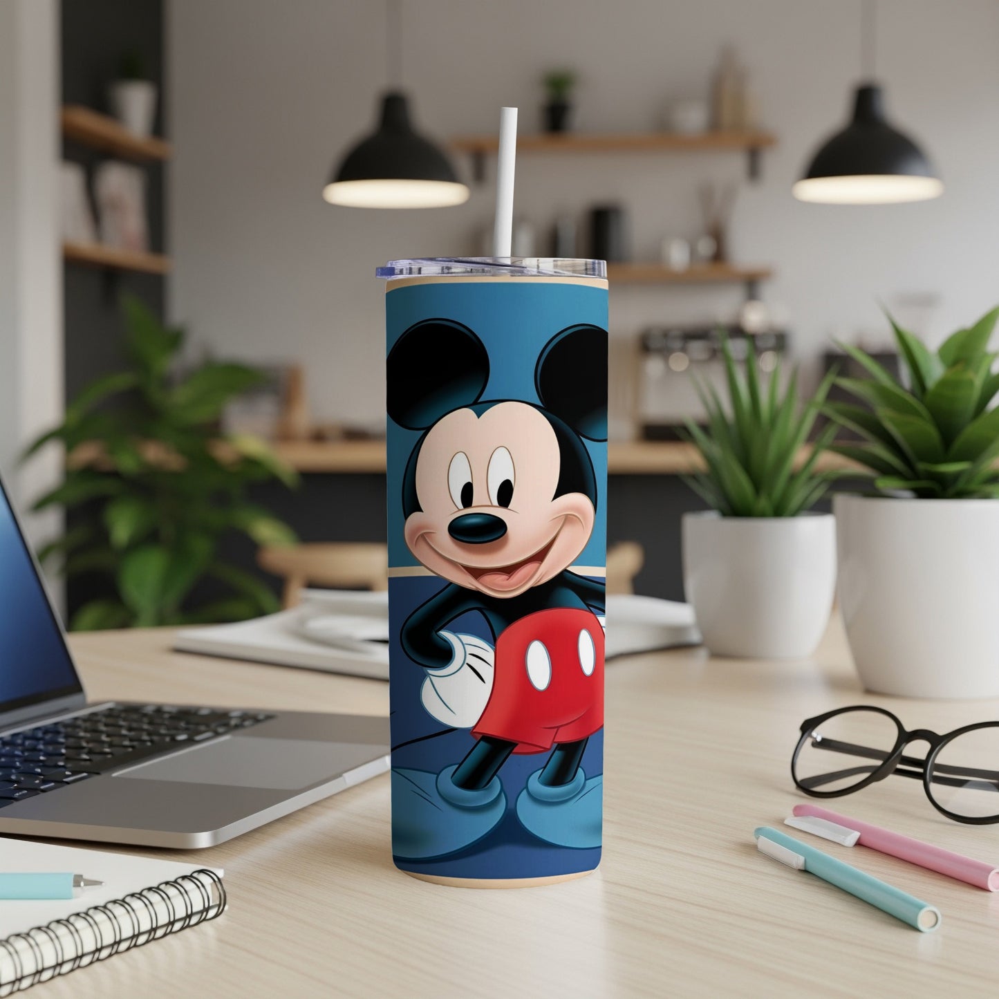 Mickey Mouse on a blue skinny tumbler with red shorts.