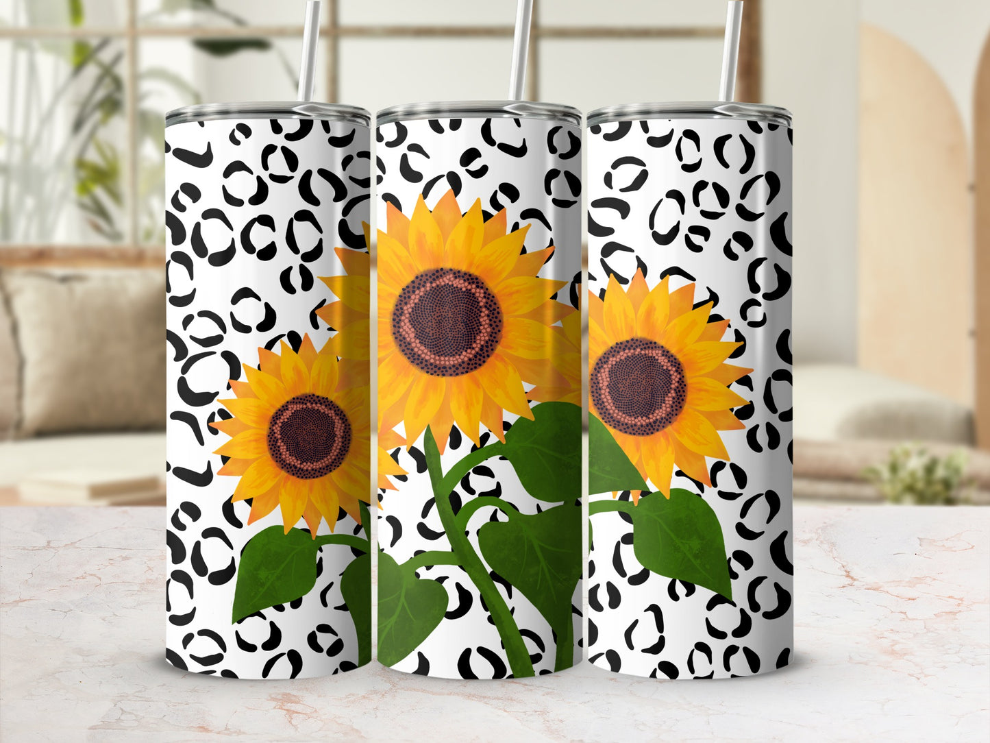Sunflower and black leopard print pattern on three tumblers.