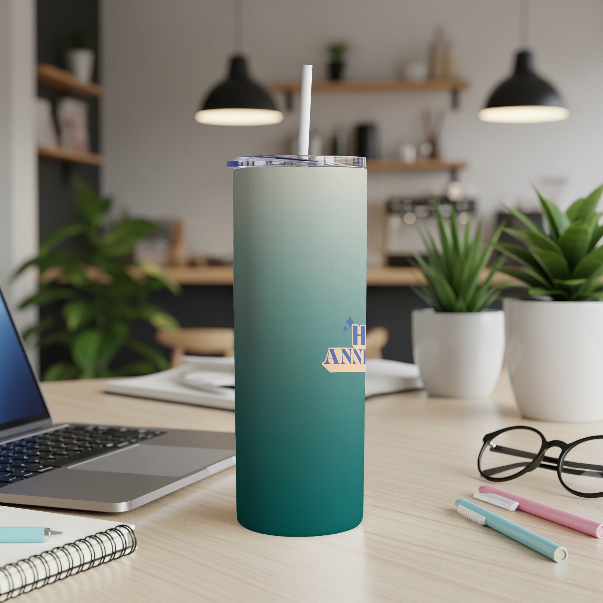 Gradient tumbler with "Happy Anniversary" text on a desk.