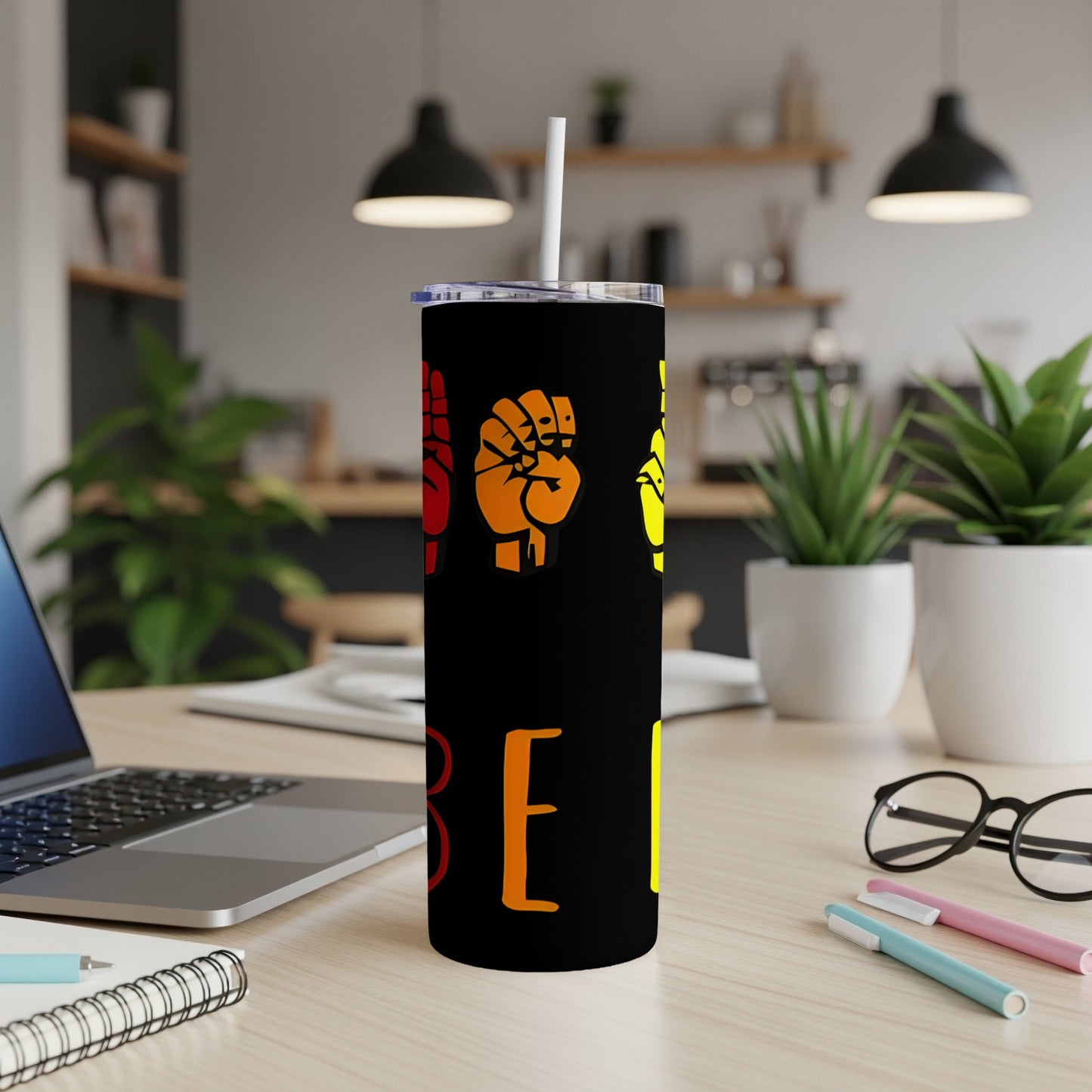 Black tumbler with raised hands in ASL spelling "BE" in orange and red.
