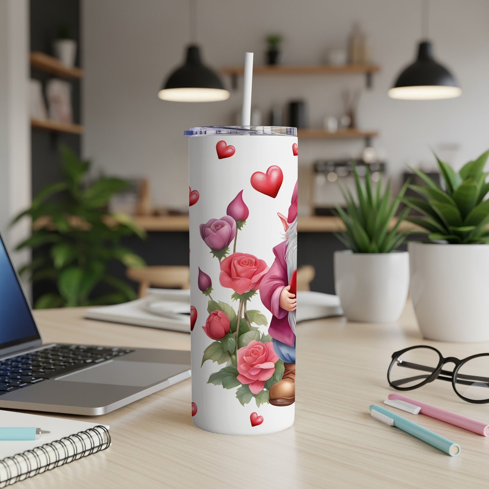 Gnome holding roses on a skinny tumbler with hearts.