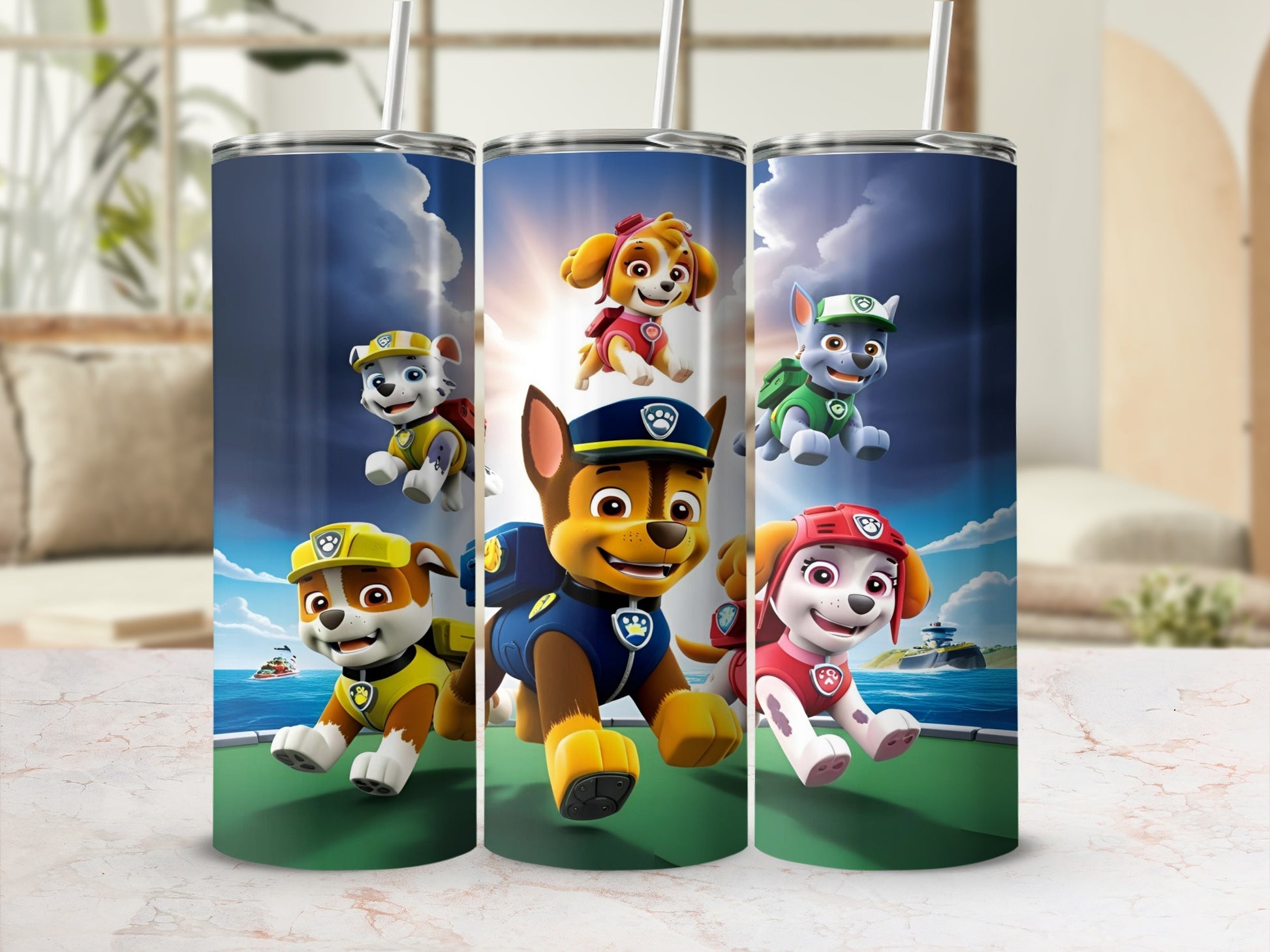 Paw Patrol characters Chase, Marshall, and Skye on a blue surface.