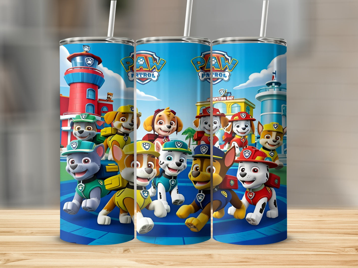 Paw Patrol characters on a blue tumbler with red and white stripes.